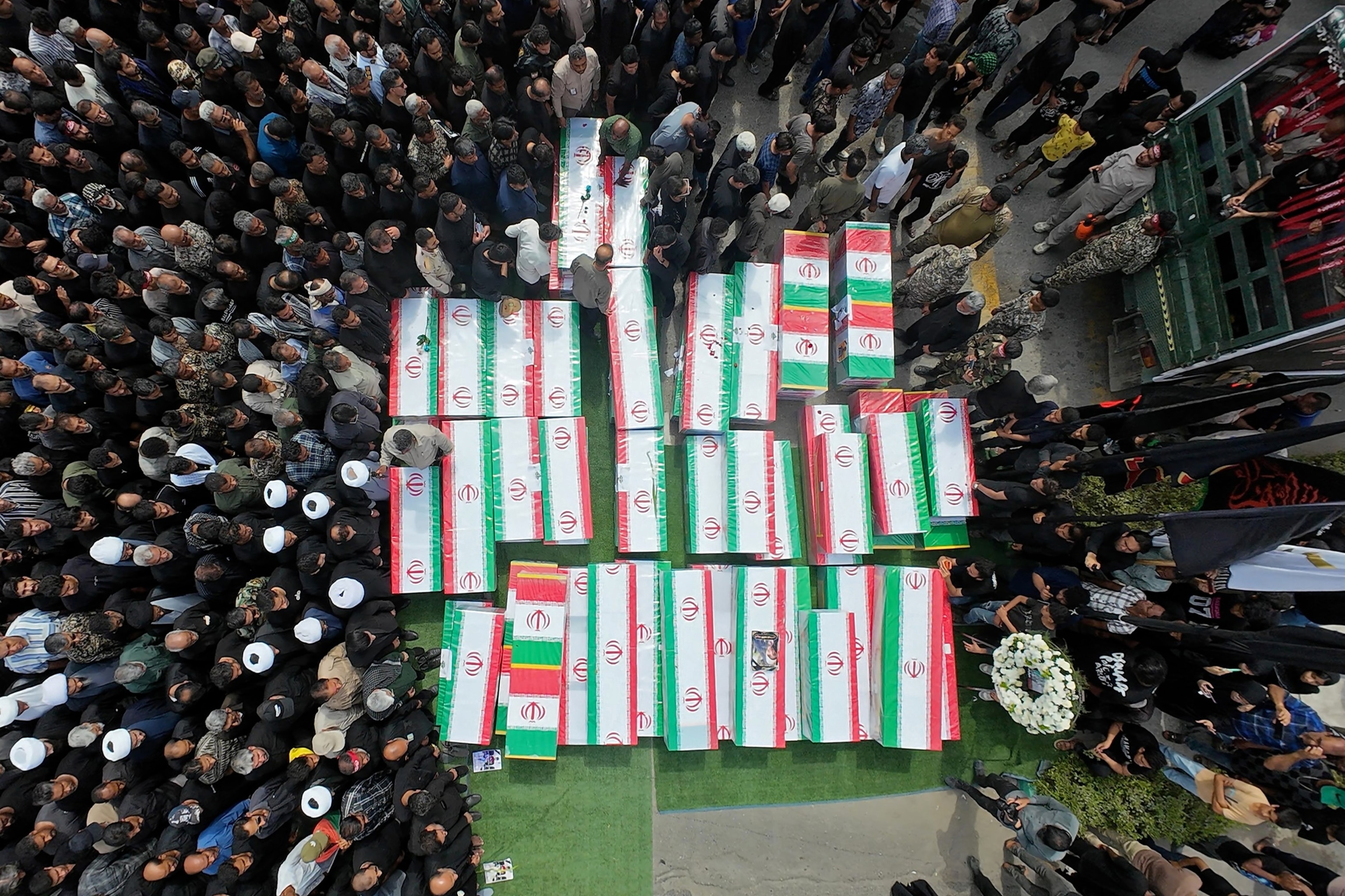 PHOTO: Coffins are assembled as funerals are held for students and staff from a girls' school, who authorities said were killed in a US-Israeli strike on February 28, on March 3, 2026, in Minab, Iran. 