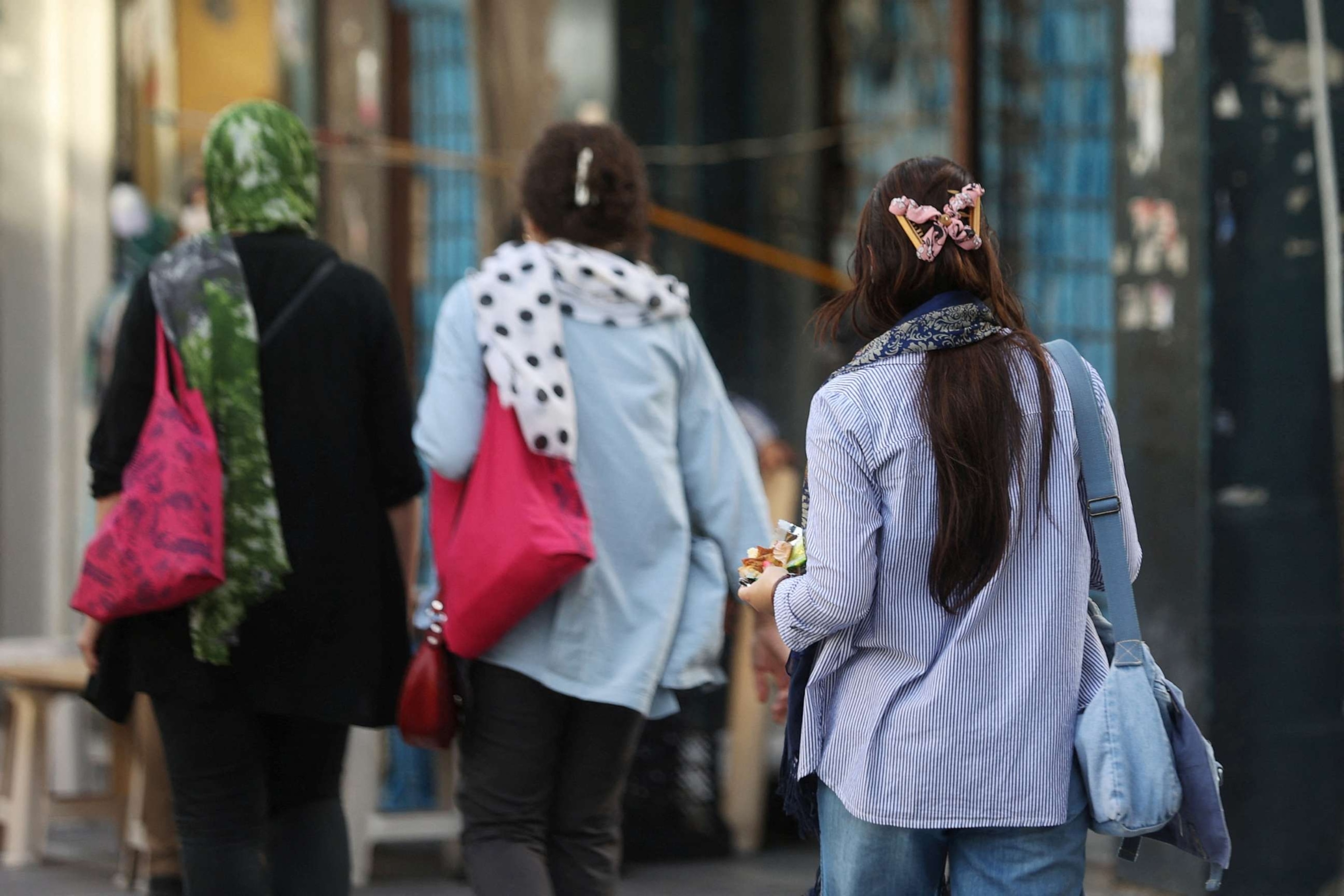 PHOTO: Iranian women walk on a street during the revival of morality police in Tehran, Iran, July 16, 2023.