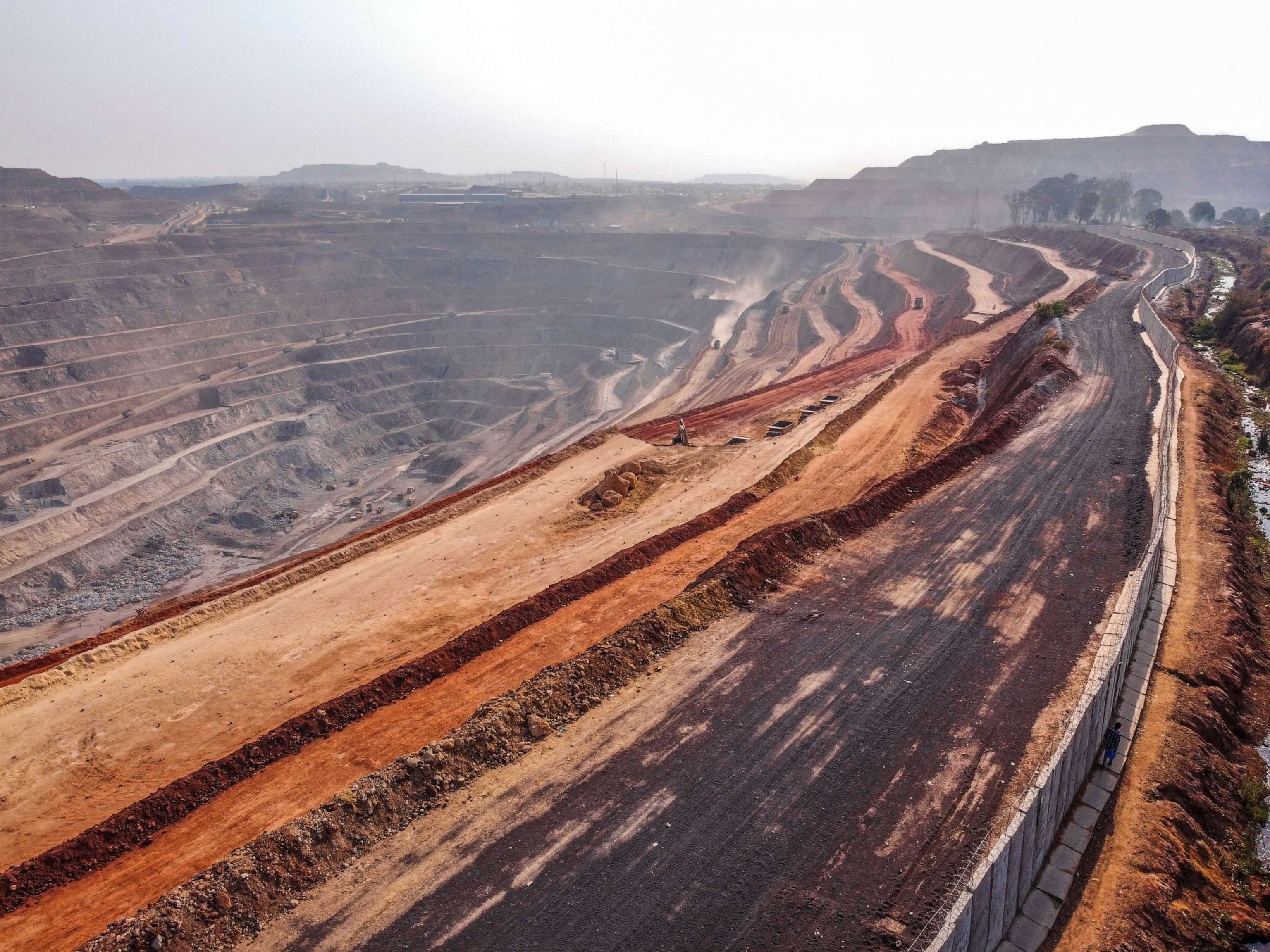 PHOTO: A view of the open pit mine in downtown Kolwezi, Democratic Republic of Congo, Oct. 13, 2022. Once a thriving neighborhood of neat houses and tree-shaded avenues, this district of the city of Kolwezi is now nearly destroyed.