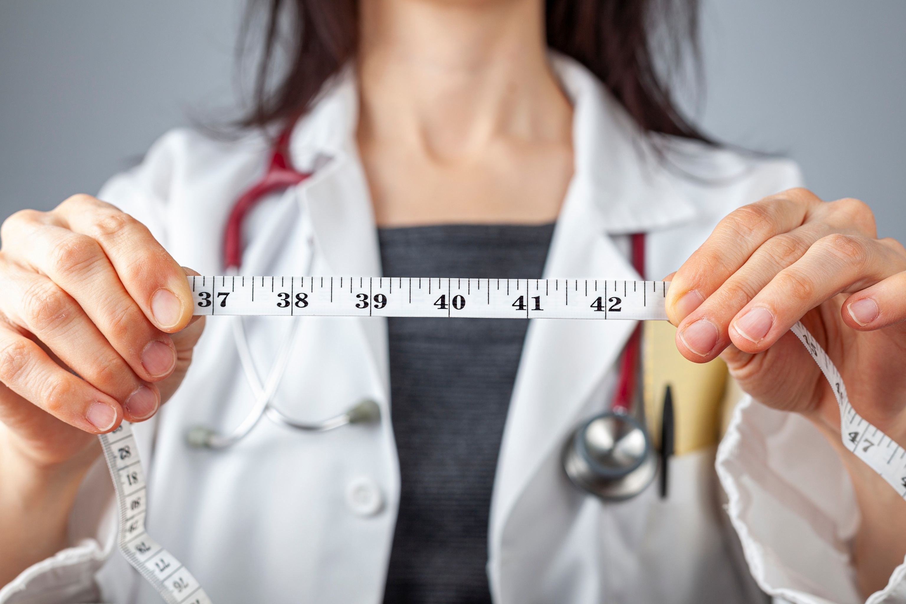 PHOTO: An undated stock photo of a doctor holding measuring tape. 