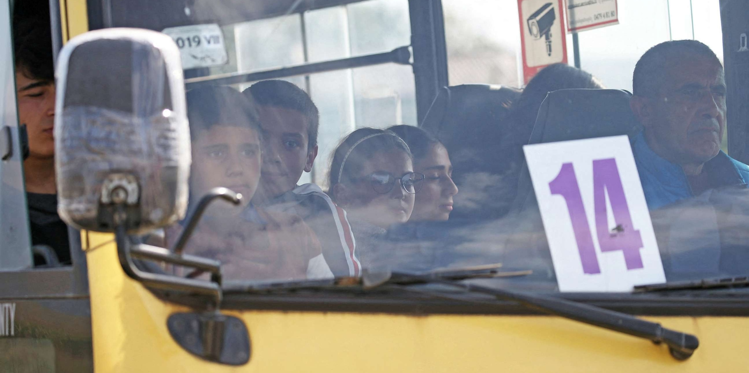 PHOTO: Refugees from Nagorno-Karabakh region sit in a bus upon their arrival in the border village of Kornidzor, Armenia, September 29, 2023.