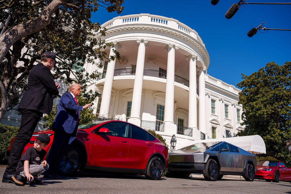 PHOTO: In this March 11, 2025, file photo, President Donald Trump, accompanied by Elon Musk, and his son, speaks next to a Tesla Model Y, a Cyber Truck, and a Model S on the South Lawn of the White House in Washington, D.C. 