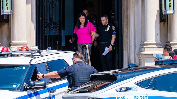 Brooklyn City Councilwoman Susan Zhuang, arrested during a protest, is removed by officers from the 62nd Precinct in Bath Beach for transport to Brooklyn Central Booking, on July 17, 2024, in New York.
