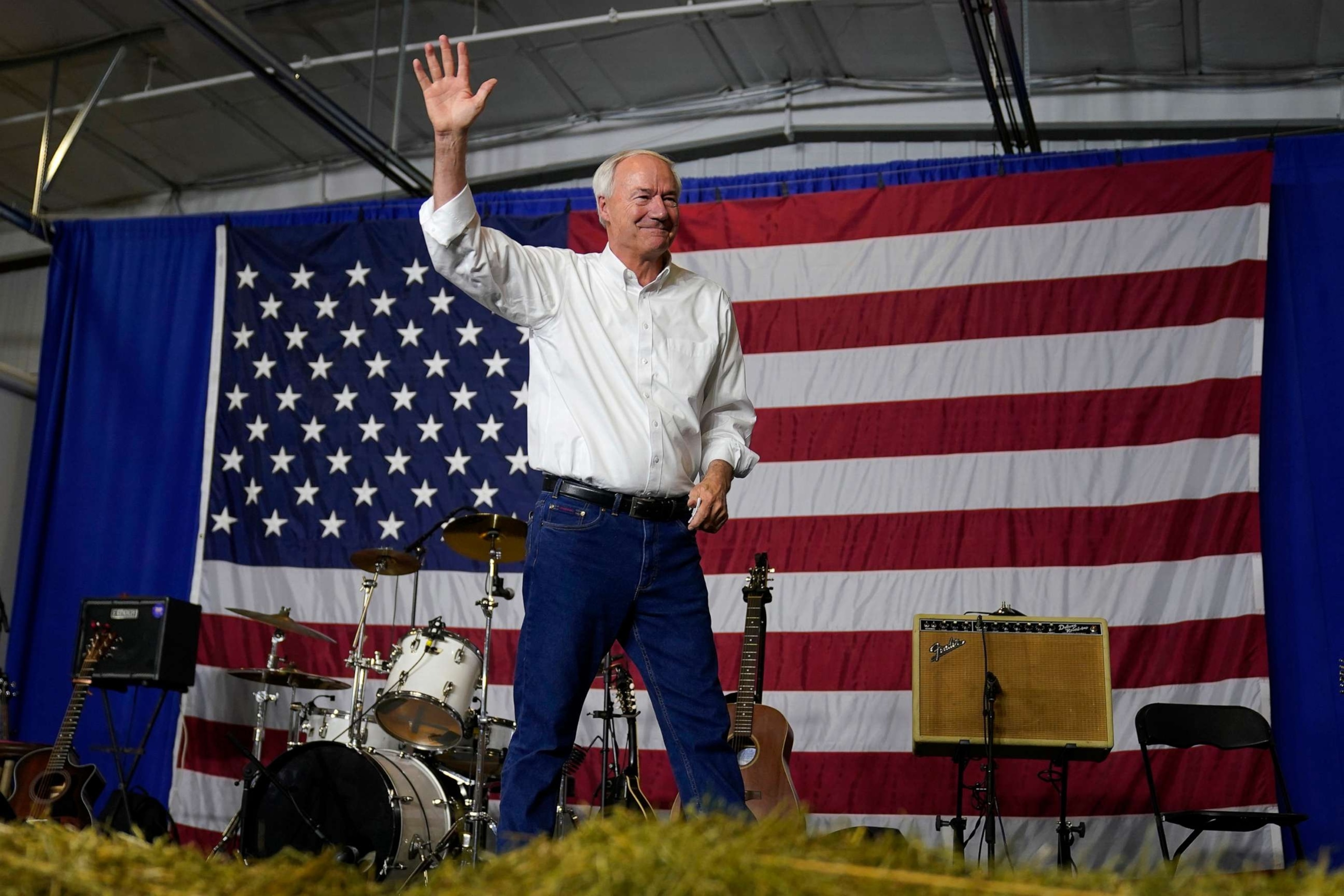 PHOTO: Republican presidential candidate former Arkansas Gov. Asa Hutchinson waves to the audience during an event on Aug. 6, 2023, in Cedar Rapids, Iowa.