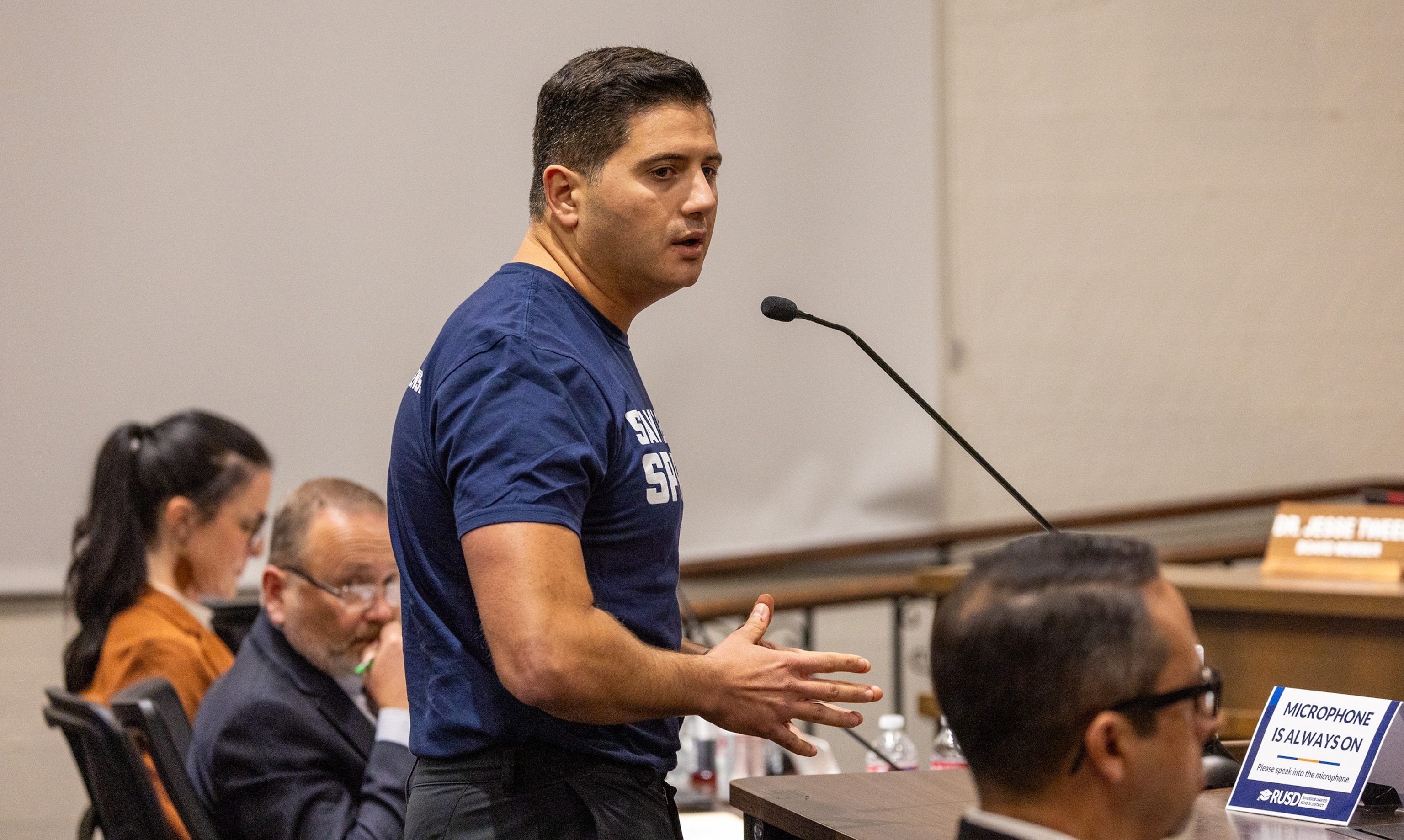 PHOTO: Assemblymember Bill Essayli speaks during community comments discussing the issue of transgender athletes competing in girls high school sports at the Riverside Unified School District meeting, Dec. 19, 2024. 