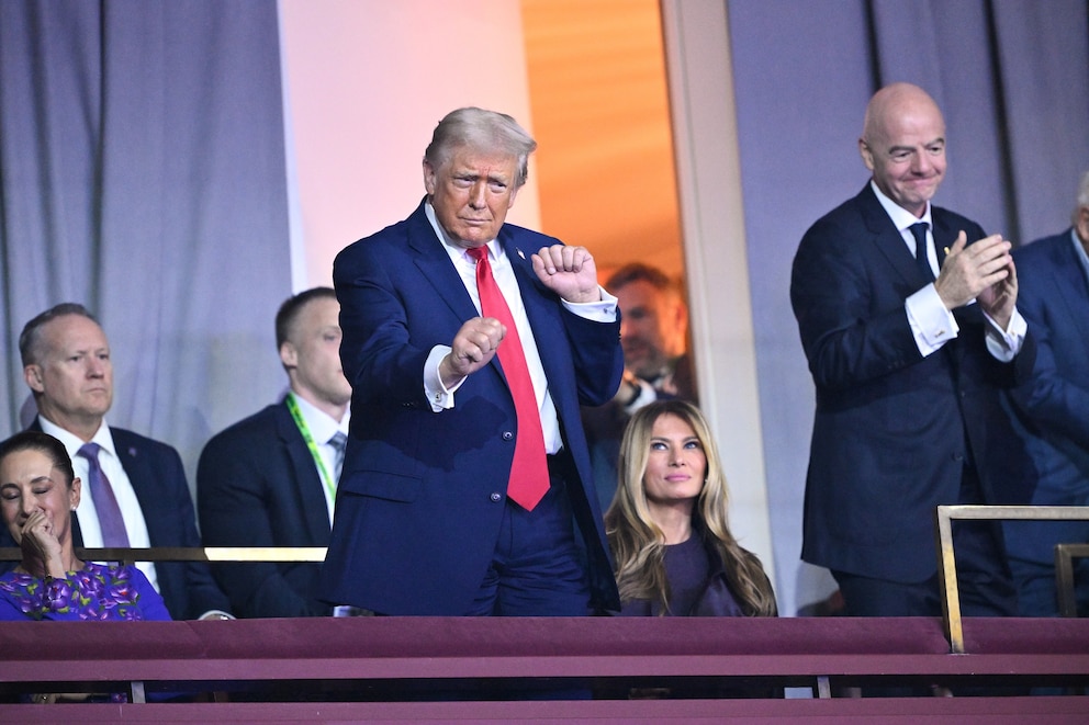 PHOTO: President Donald Trump dances as The Village People perform the song "YMCA" at the end of the draw for the 2026 soccer World Cup at the Kennedy Center in Washington, Dec. 5, 2025.