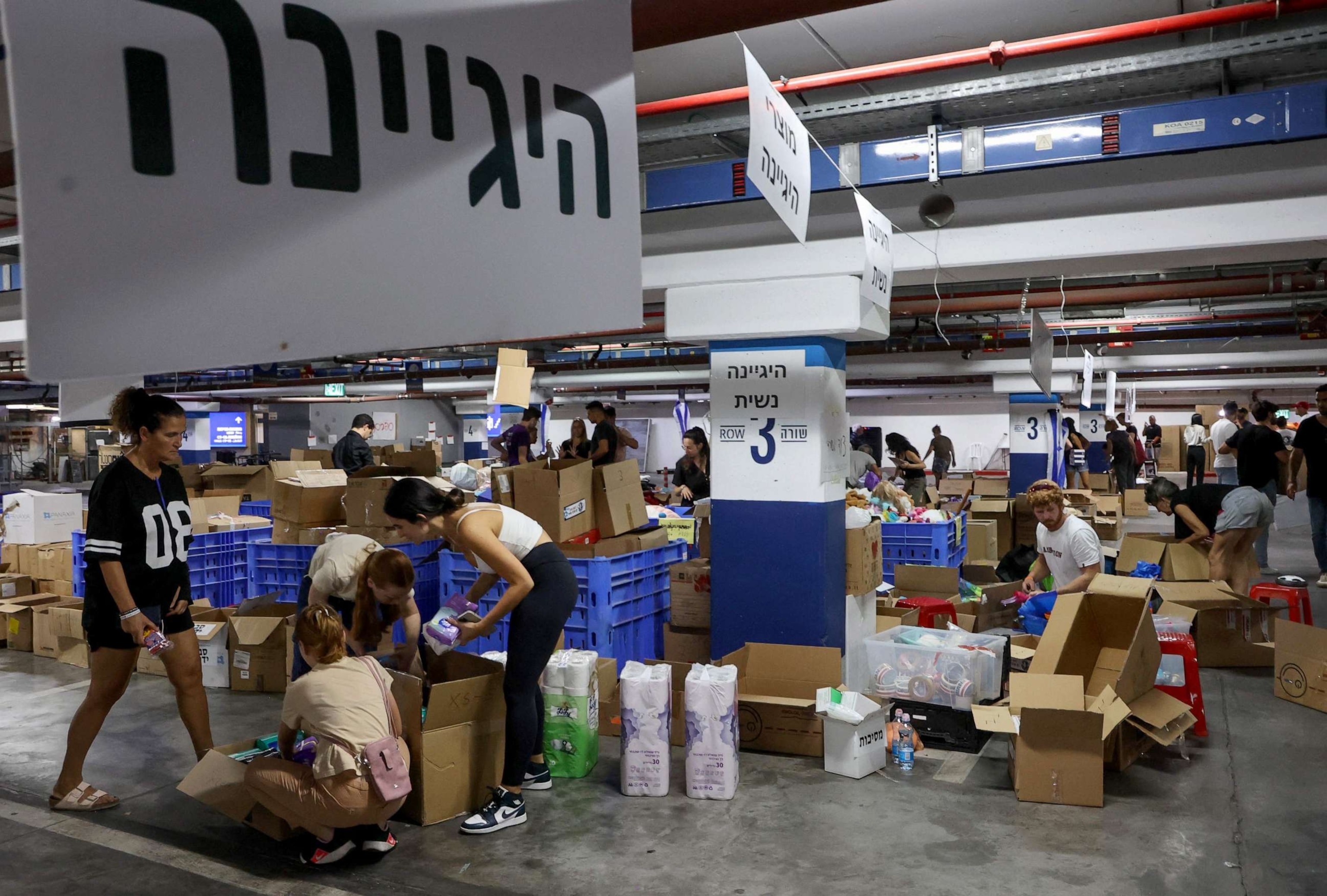 PHOTO: Volunteers prepare aid packages and supplies for Israeli soldiers and evacuated residents in Tel Aviv on October 12, 2023.