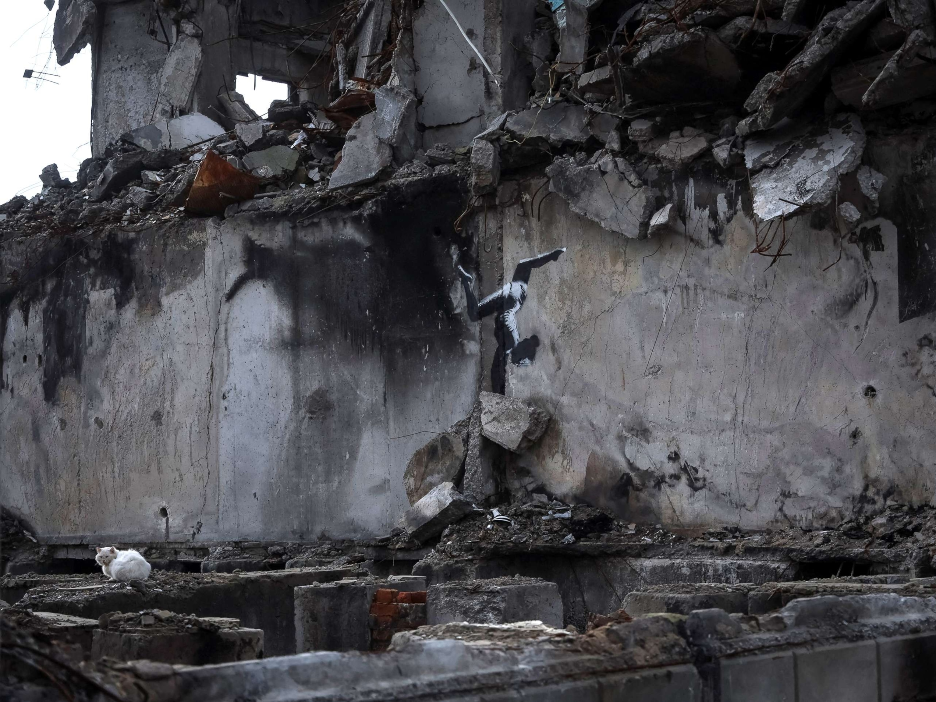 PHOTO: A work of world-renowned graffiti artist Banksy is seen at the wall of destroyed building in the Ukrainian town of Borodianka, on Nov. 12, 2022.