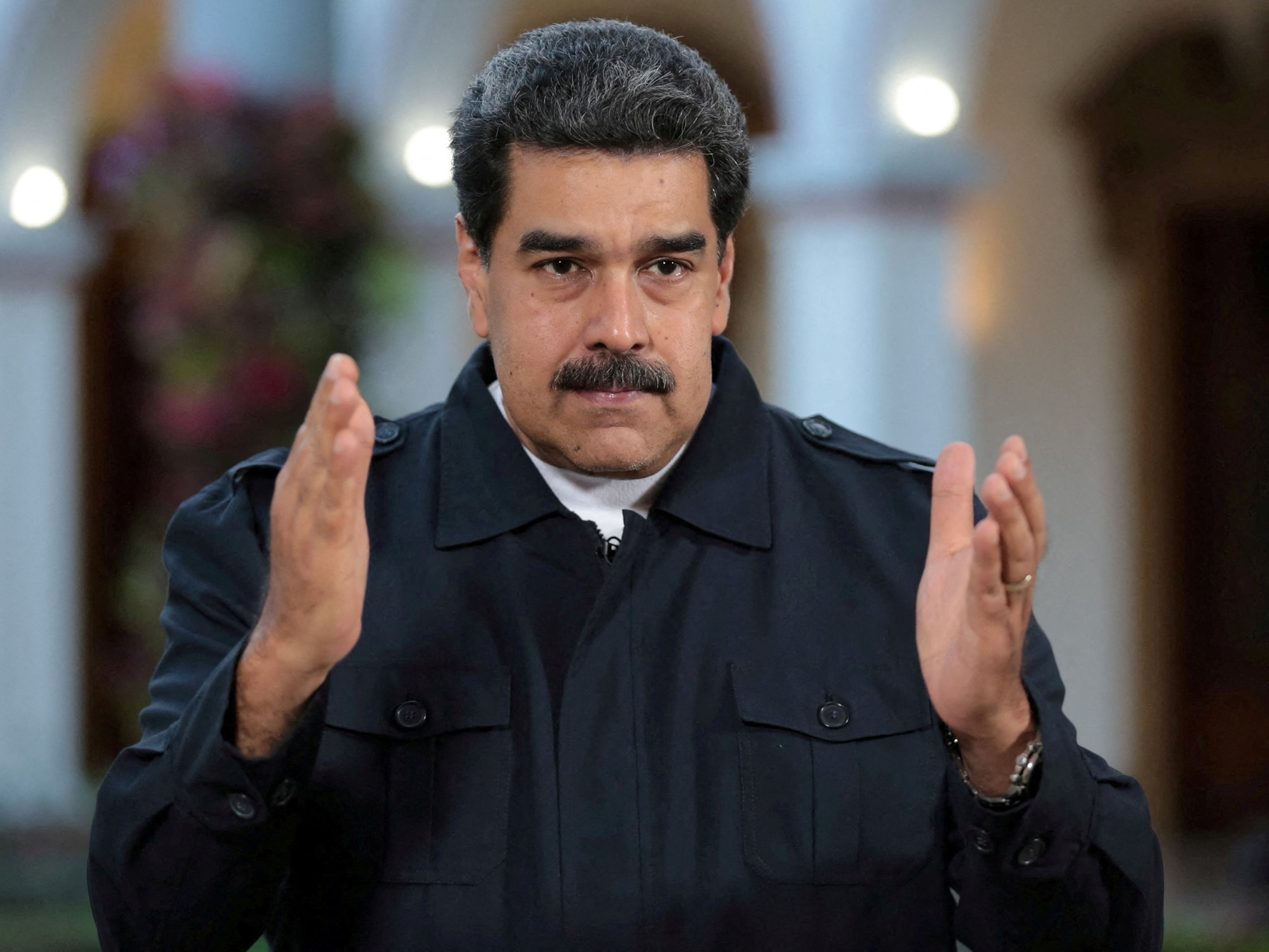 PHOTO: FILE PHOTO: Venezuela's President Nicolas Maduro speaks during a broadcast at Miraflores Palace in Caracas