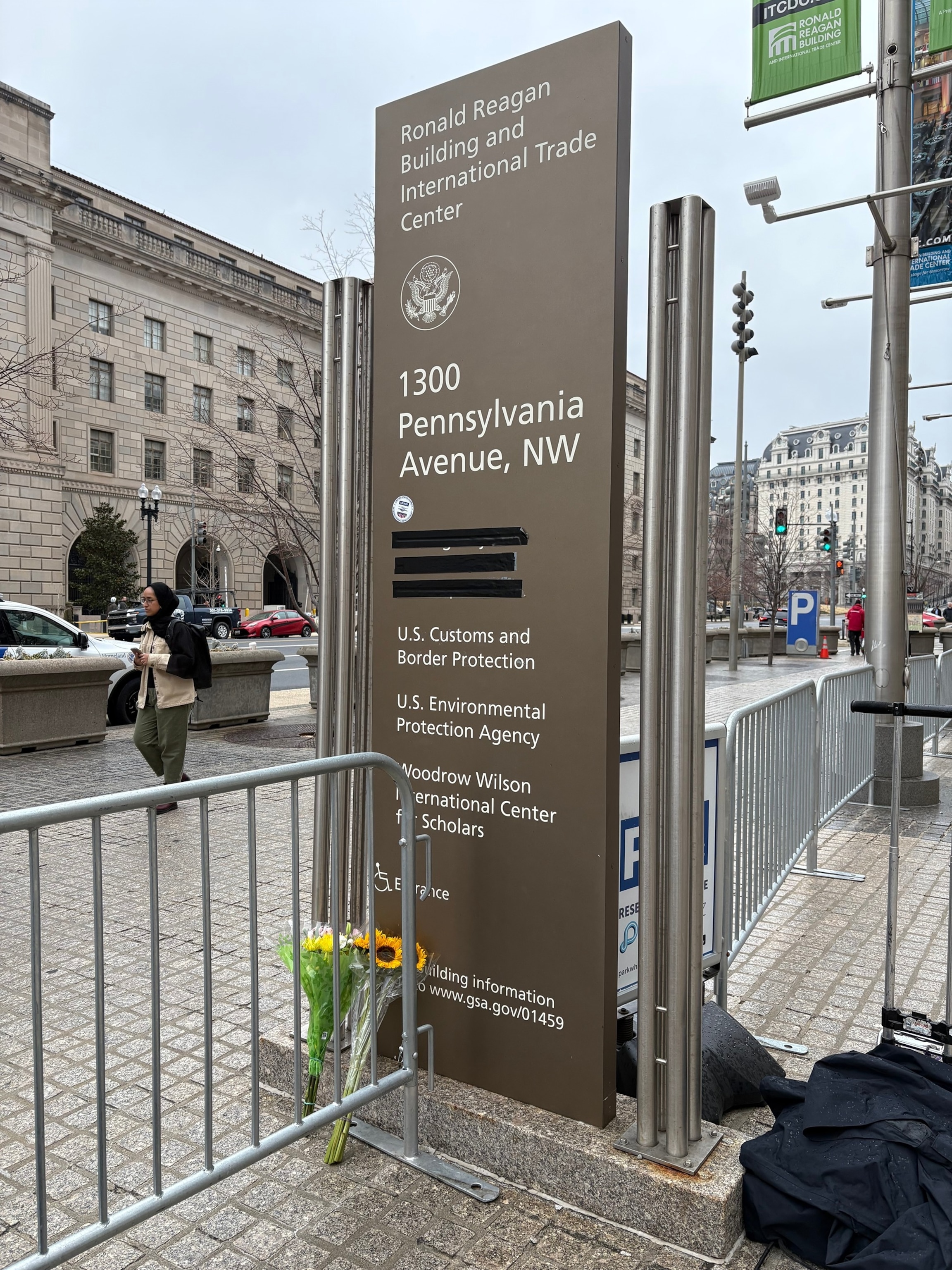 PHOTO: The sign outside the entrance of the Ronald Reagan Building in Washington, D.C., where black tape had been placed over the USAID office name prior to a demonstration for ousted USAID workers who were asked to clear out their desks.