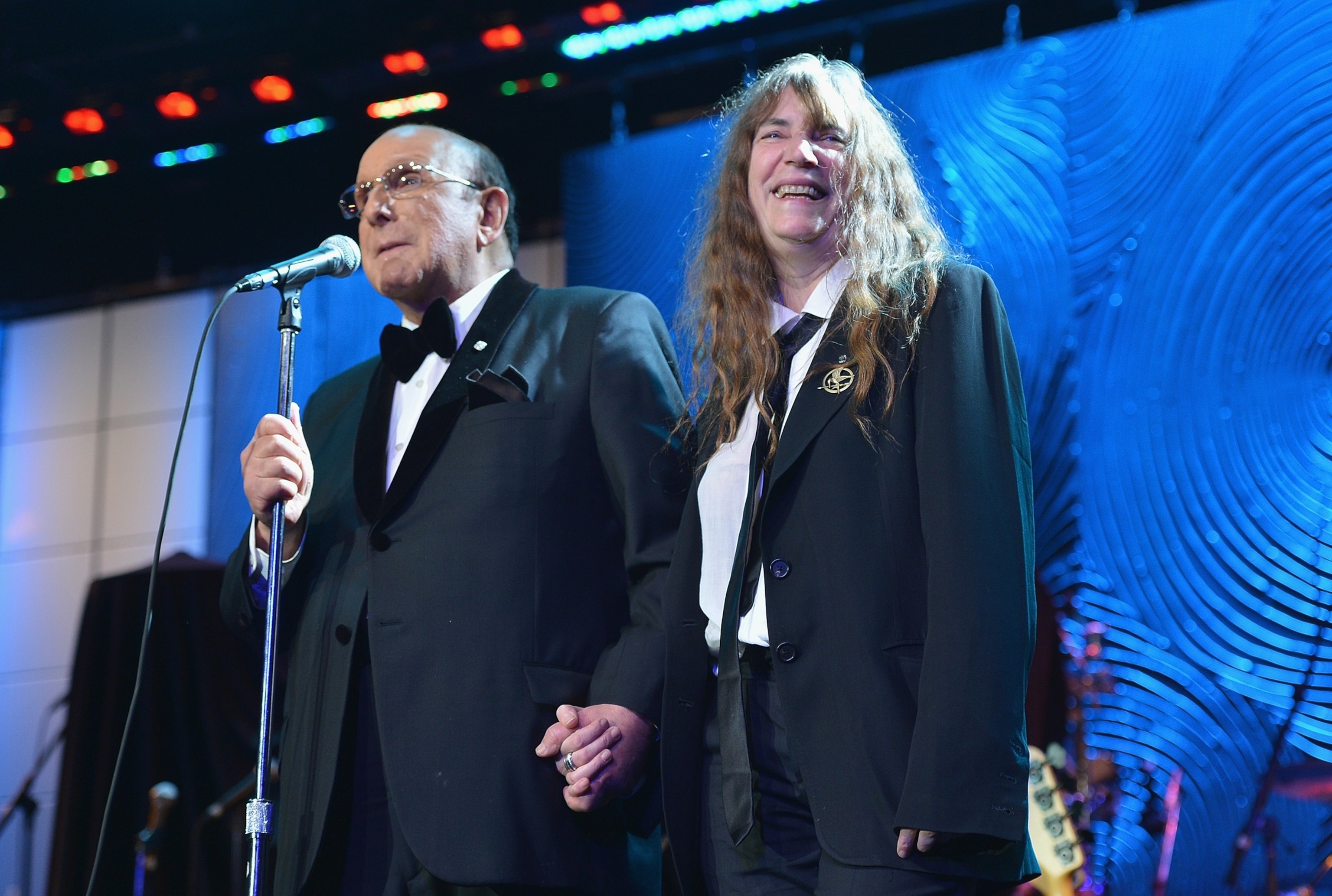 PHOTO: Sony Music Entertainment CCO Clive Davis (L) and singer Patti Smith speak onstage at the 55th Annual GRAMMY Awards Pre-GRAMMY Gala and Salute to Industry Icons honoring L.A. Reid held at The Beverly Hilton on February 9, 2013. 