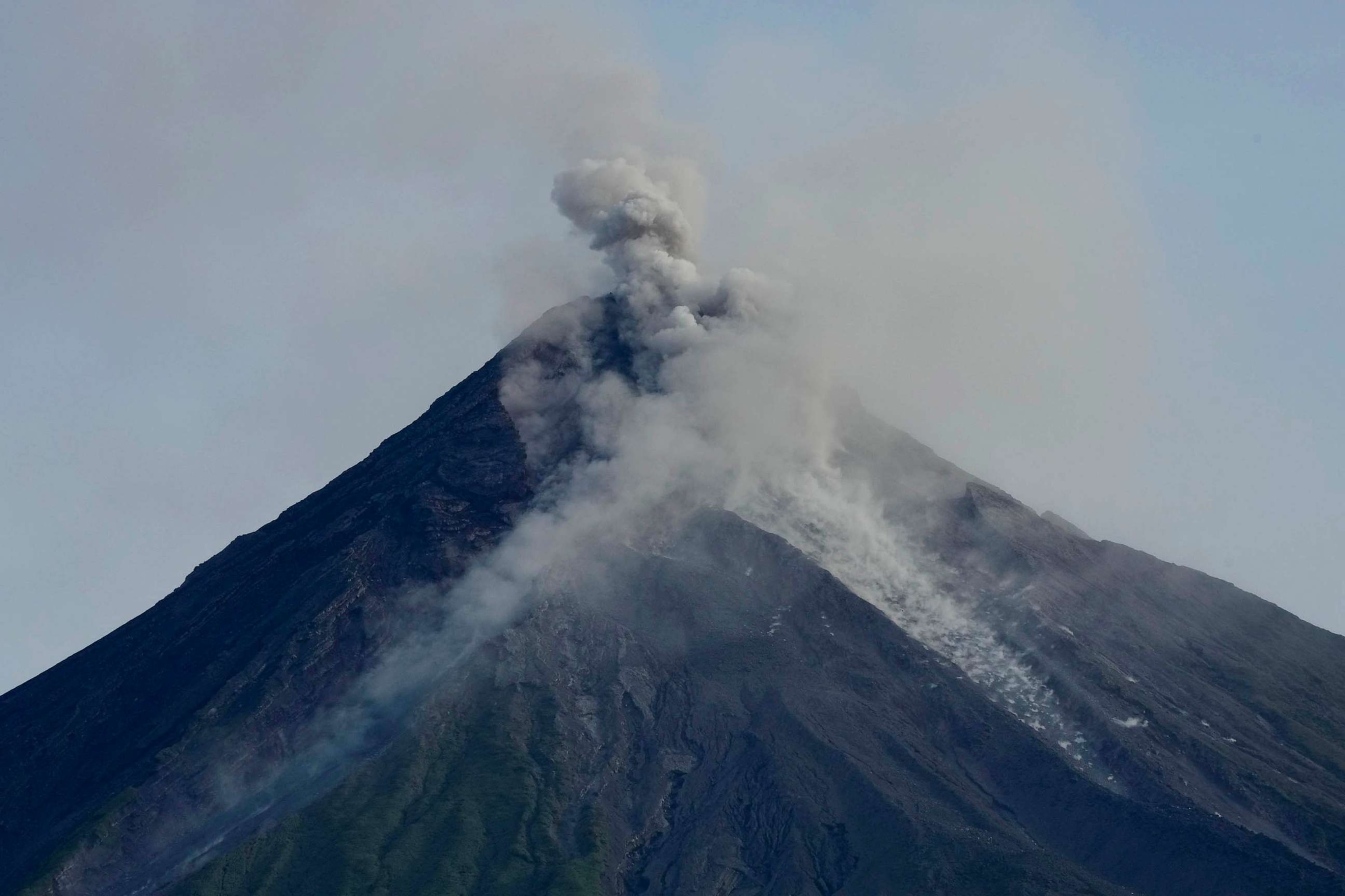 PHOTO: Mayon volcano spews ash and lava as seen from Daraga town, Albay province, northeastern Philippines, June 14, 2023.