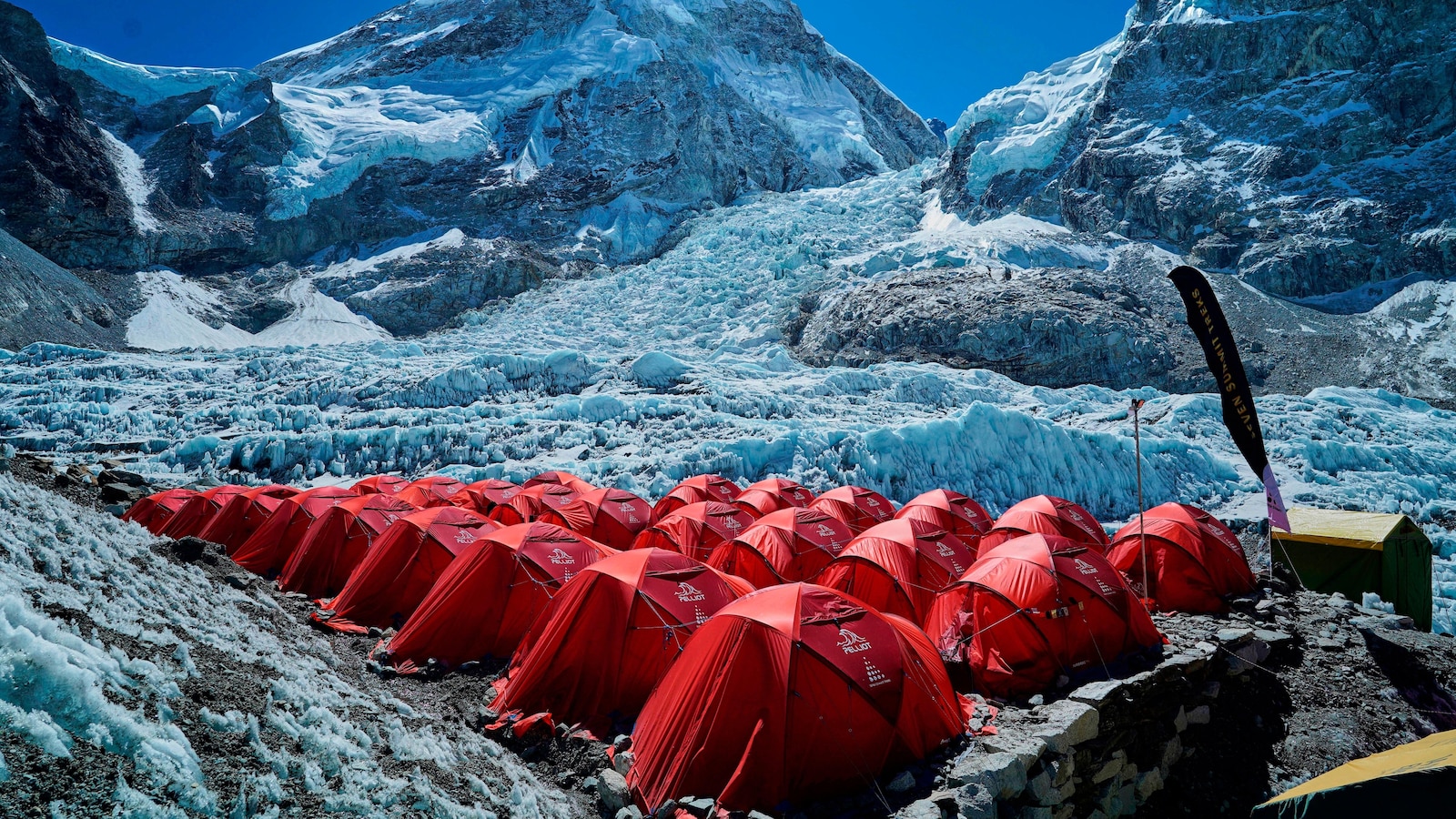 Mount Everest season opens late, with climbers undeterred by huge ice block and high travel costs