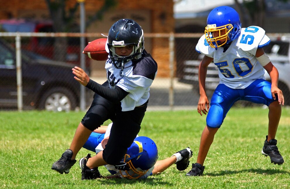 PHOTO: Stock photo of children playing tackle football.