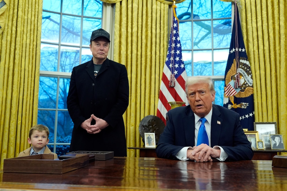 PHOTO: President Donald Trump is  joined by Elon Musk and his son X Æ A-Xii, as he signs a series of executive orders in the Oval Office at the White House on Feb. 11, 2025 in Washington.