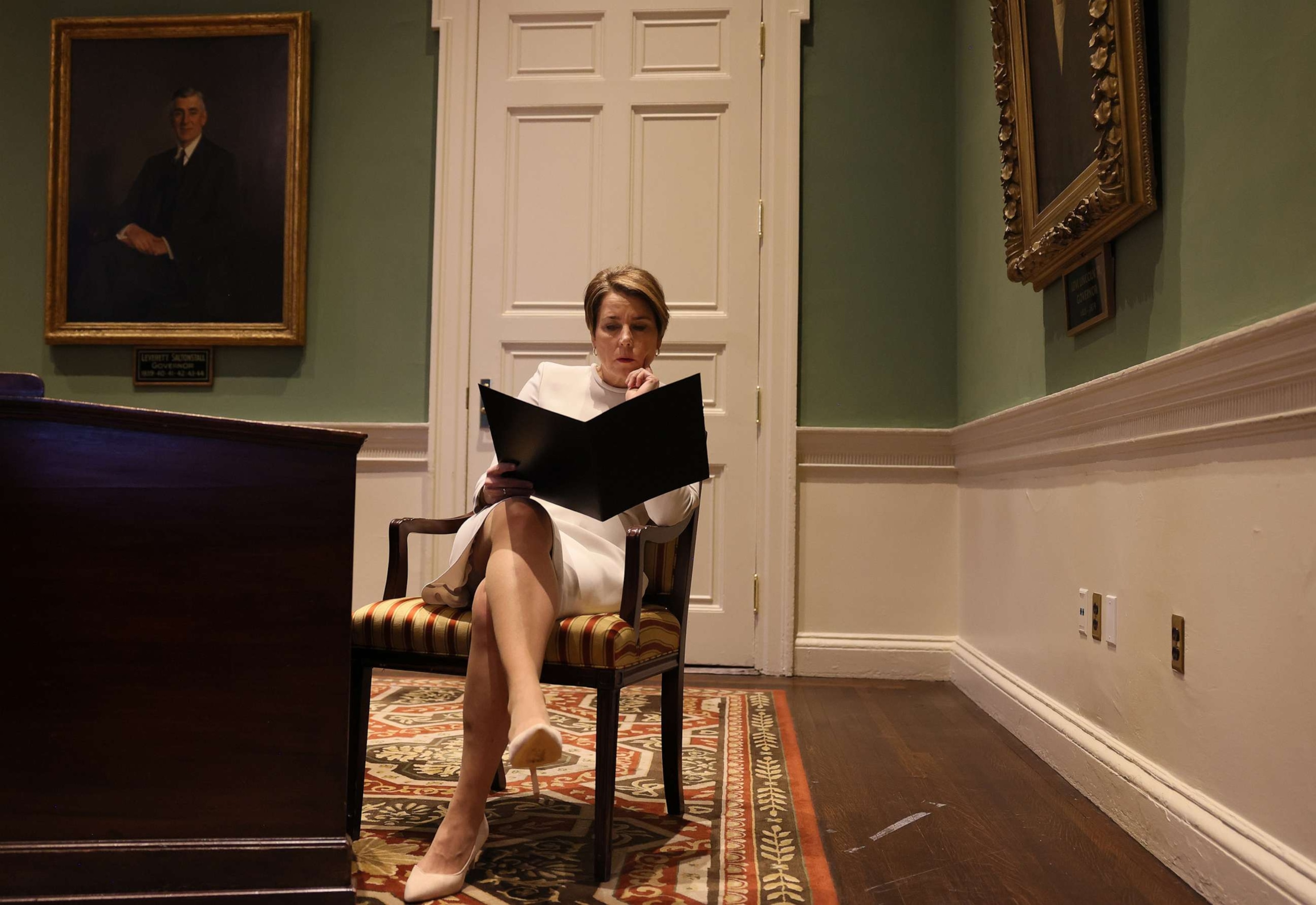 PHOTO: Massachusetts Governor-elect Maura Healey goes over her speech inside the Governors Council Chamber before the Inauguration, Jan. 5,2023, in Boston.