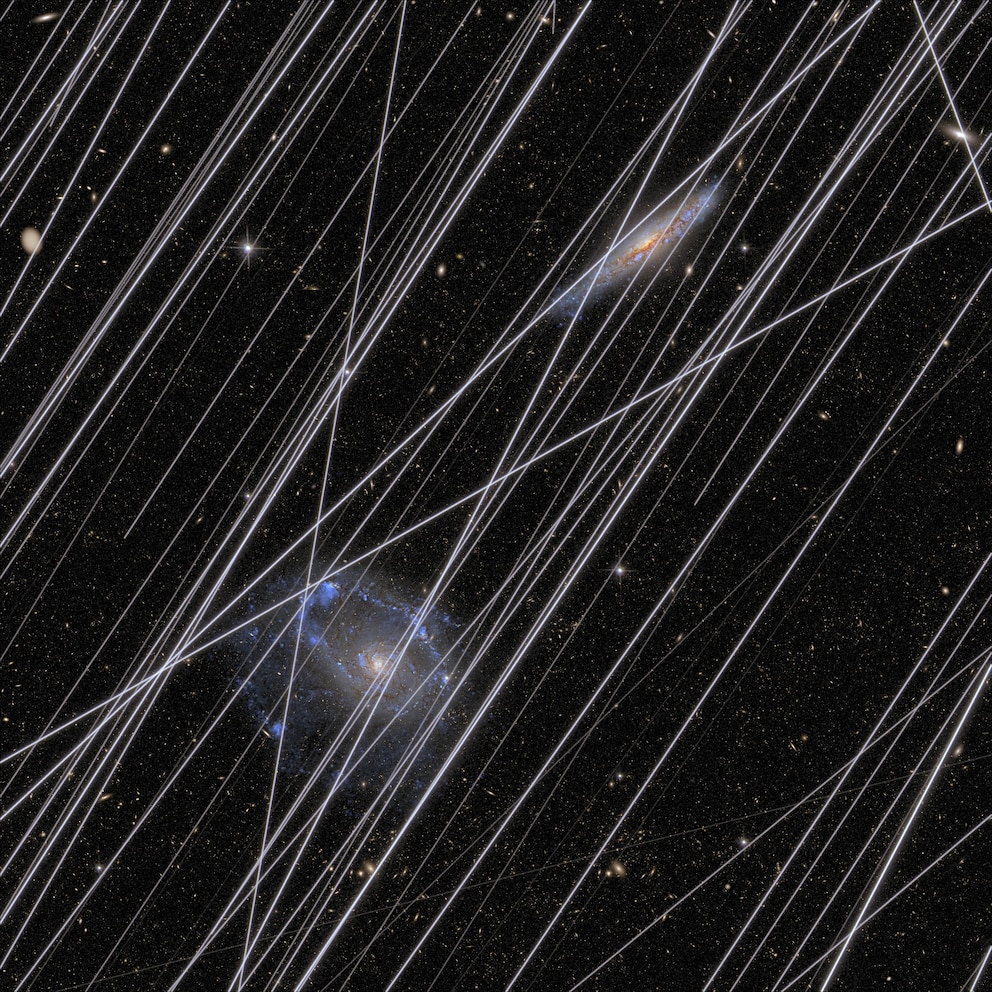 PHOTO: This handout document obtained, Dec. 3, 2025, from the NASA shows an image simulating how lights from satellites contaminate images of the universe taken by space telescopes.