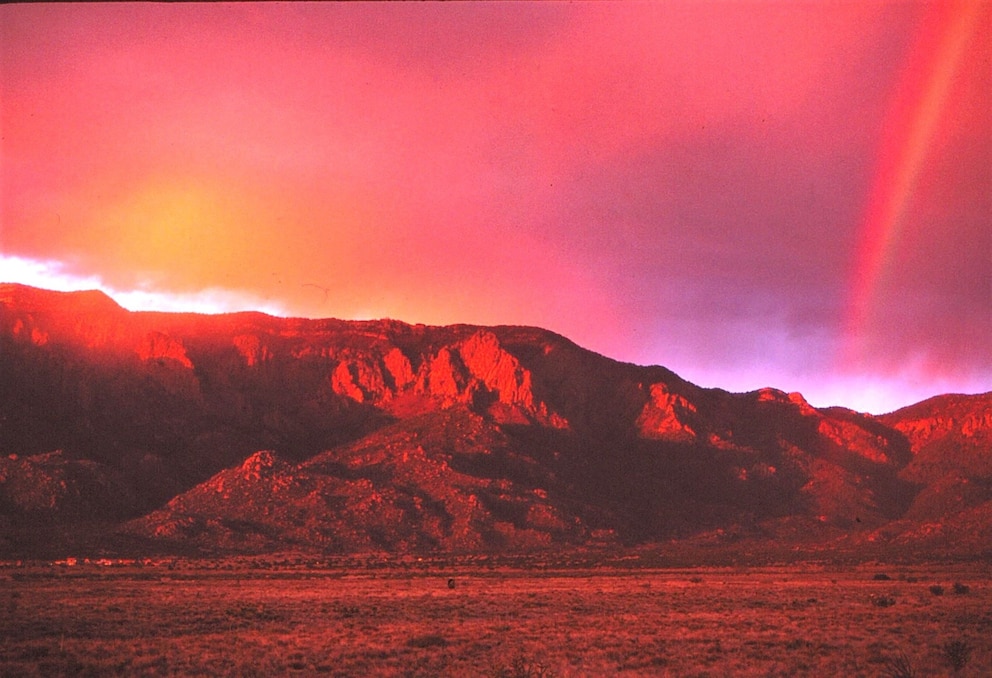 PHOTO: Sunset at the Sandia Mountains east of Albuquerque, New Mexico, is captured along with a rainbow in this undated photo. The entire state of New Mexico is under red flag warnings, April 17, 2025.