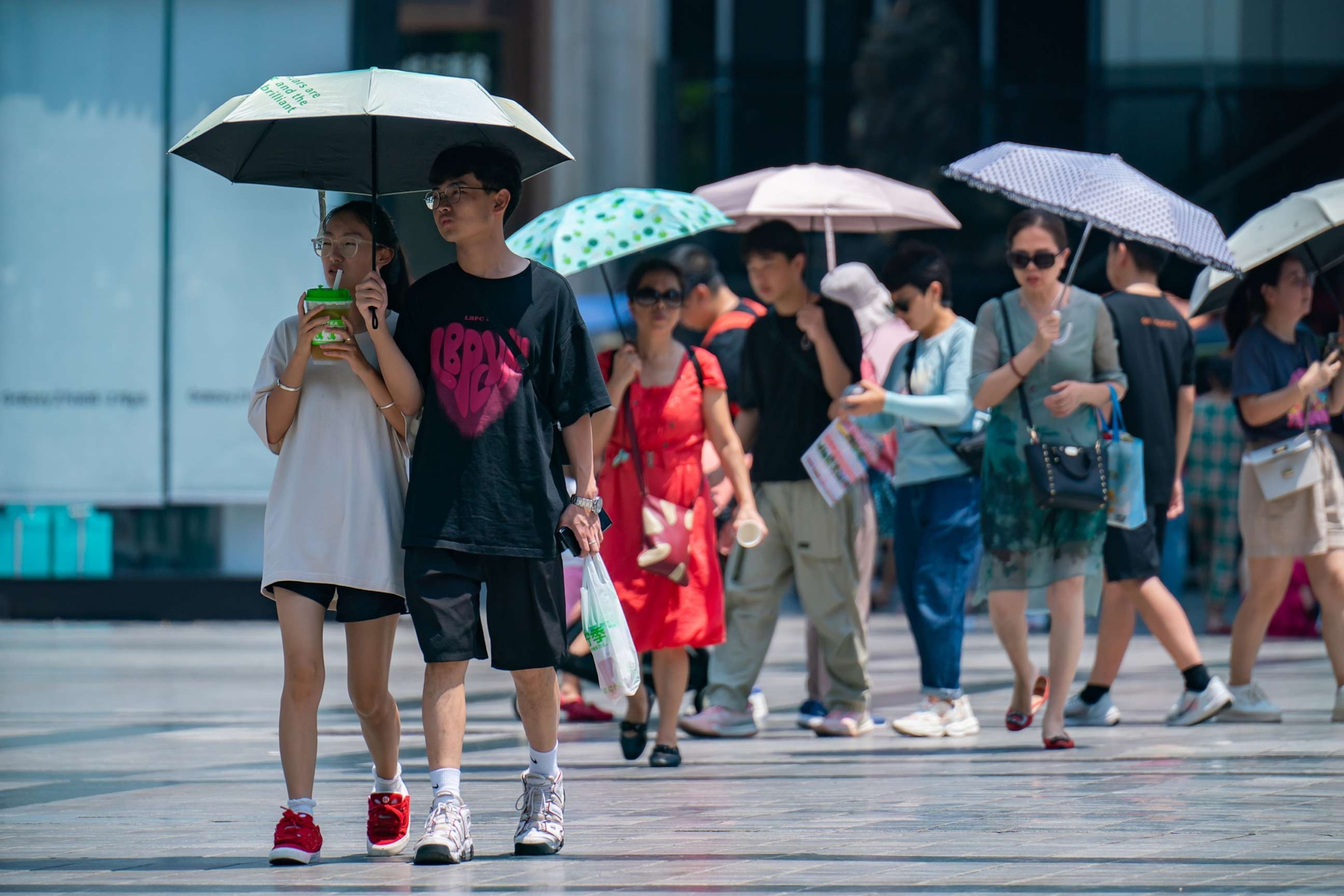 PHOTO: Tourists travel in high temperatures in Chongqing, China, Aug. 17, 2023.