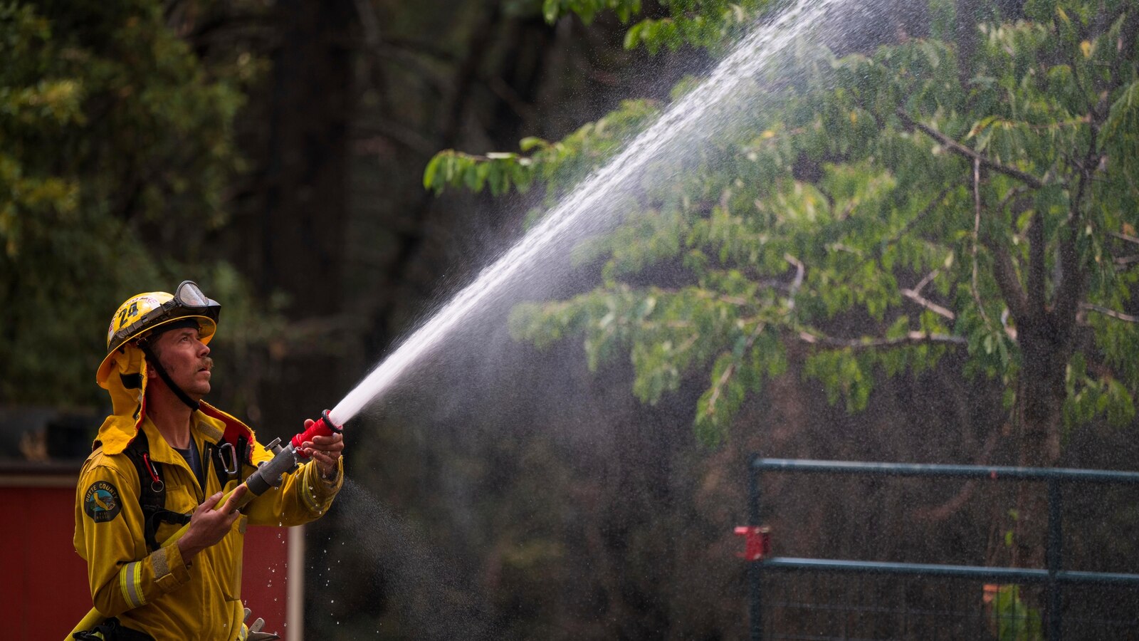  Firefighters helped by cooler weather battle blaze that has scorched area size of Los Angeles