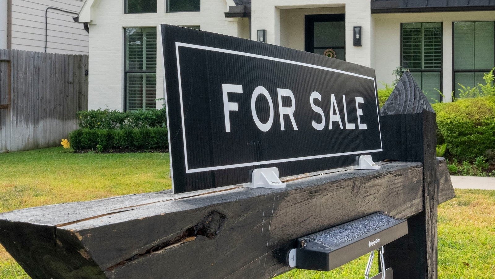 A for sale sign is seen in front of a house in a Spring Branch neighborhood in Houston, Oct. 27, 2025.