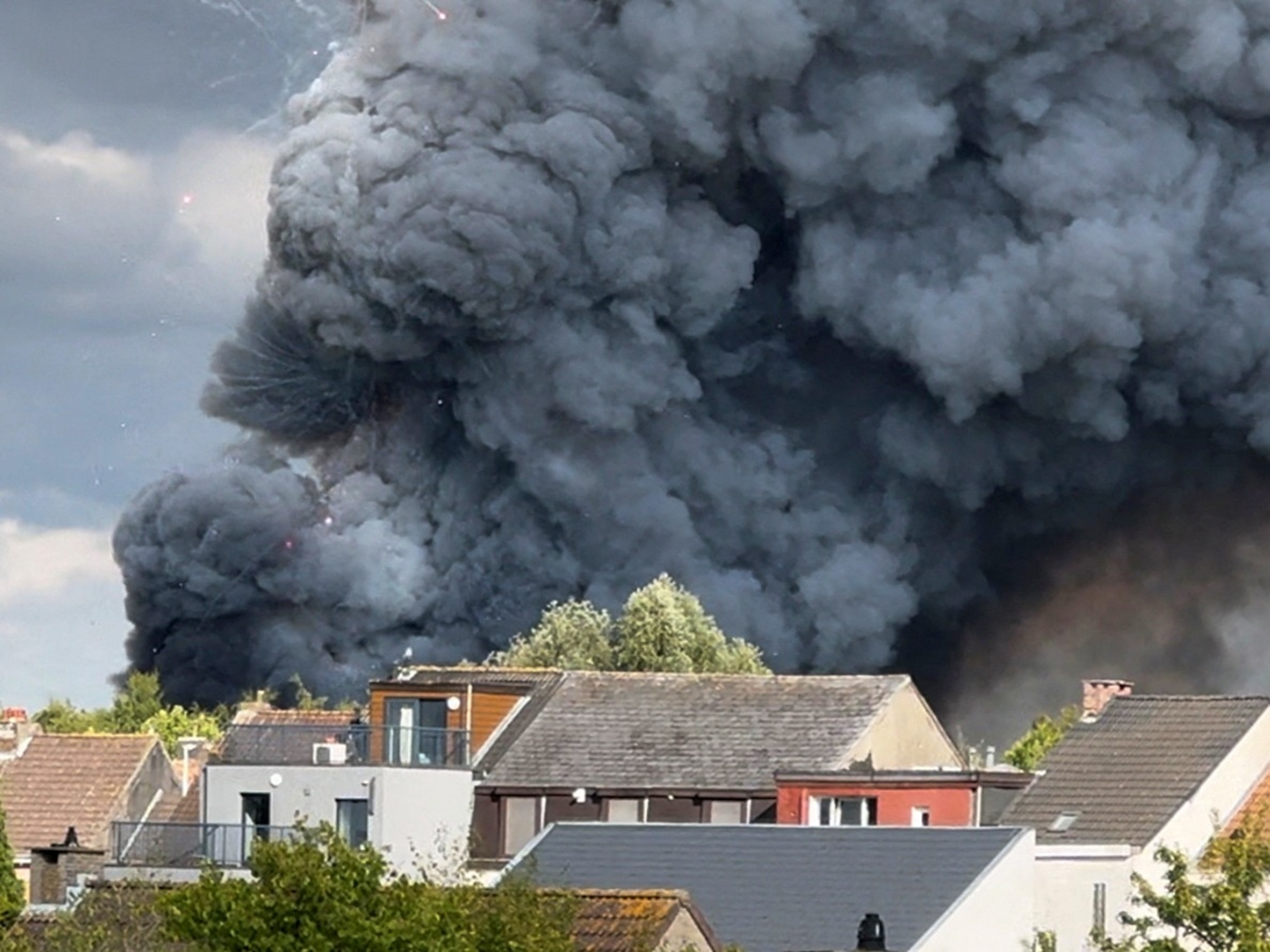 PHOTO: Fireworks burst and smoke rises as a fire engulfs the main stage of Tomorrowland, an electronic music event, in Boom, Belgium, July 16, 2025, in this still image from social media video.