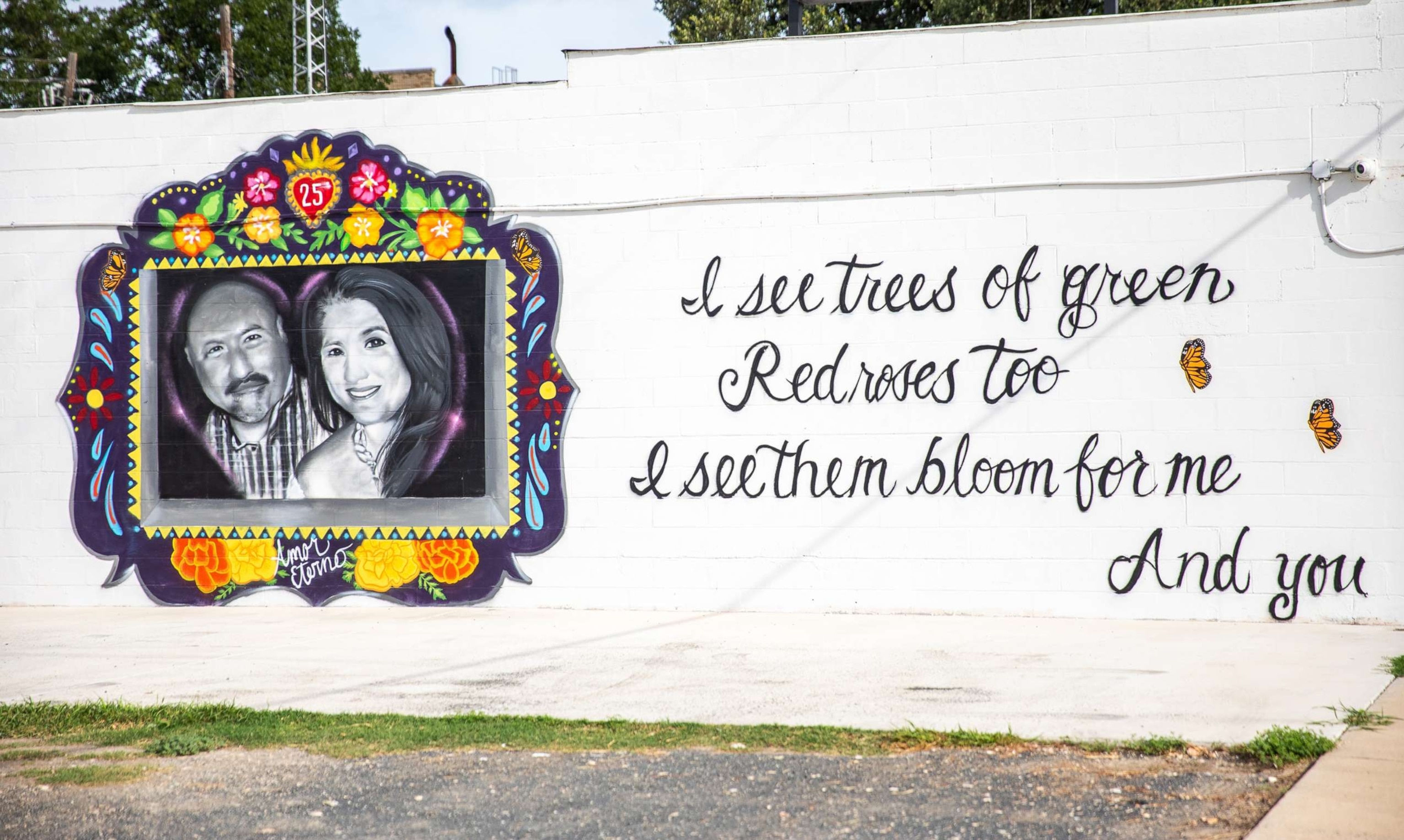 PHOTO: A mural in honor of Irma Garcia and Joe Garcia is seen on the wall of a building in downtown Uvalde, Texas, Aug. 21, 2022.