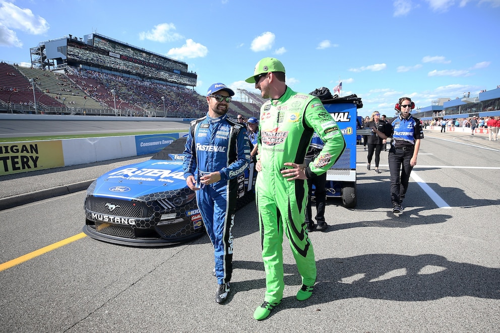 PHOTO: Ricky Stenhouse Jr., talks with Kyle Busch during qualifying for the Monster Energy NASCAR Cup Series Consumers Energy 400 at Michigan International Speedway, on Aug. 9, 2019, in Brooklyn, Michigan.