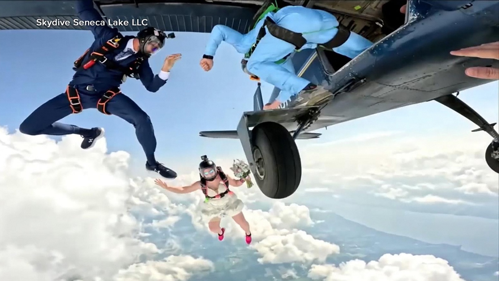 One couple took their love to new heights — kicking off their wedding celebration by jumping out of a plane from 14,000 feet alongside members of their wedding 