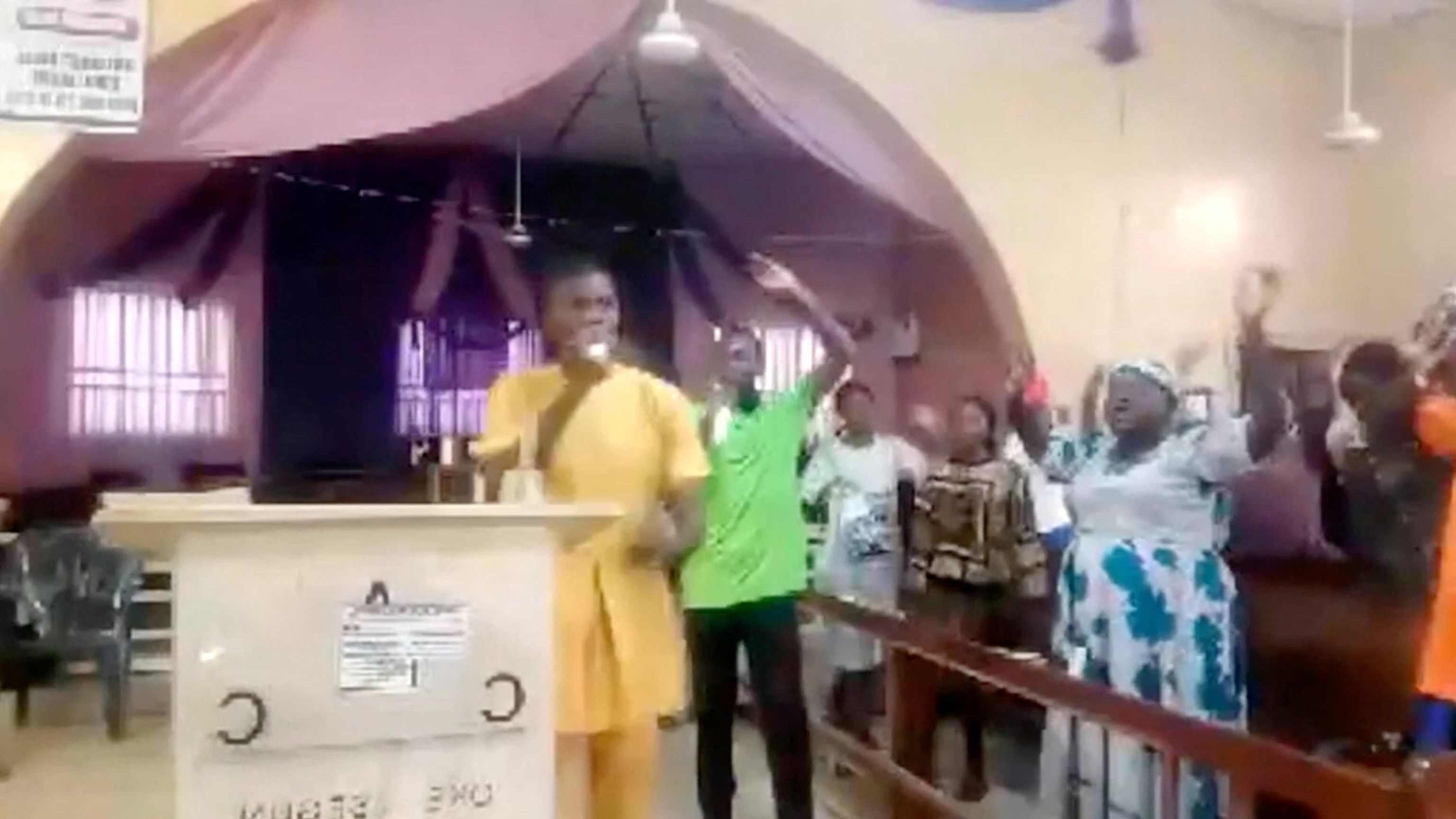 PHOTO: Worshippers pray ahead of hearing gunshots and gunmen entering the Church in Eruku