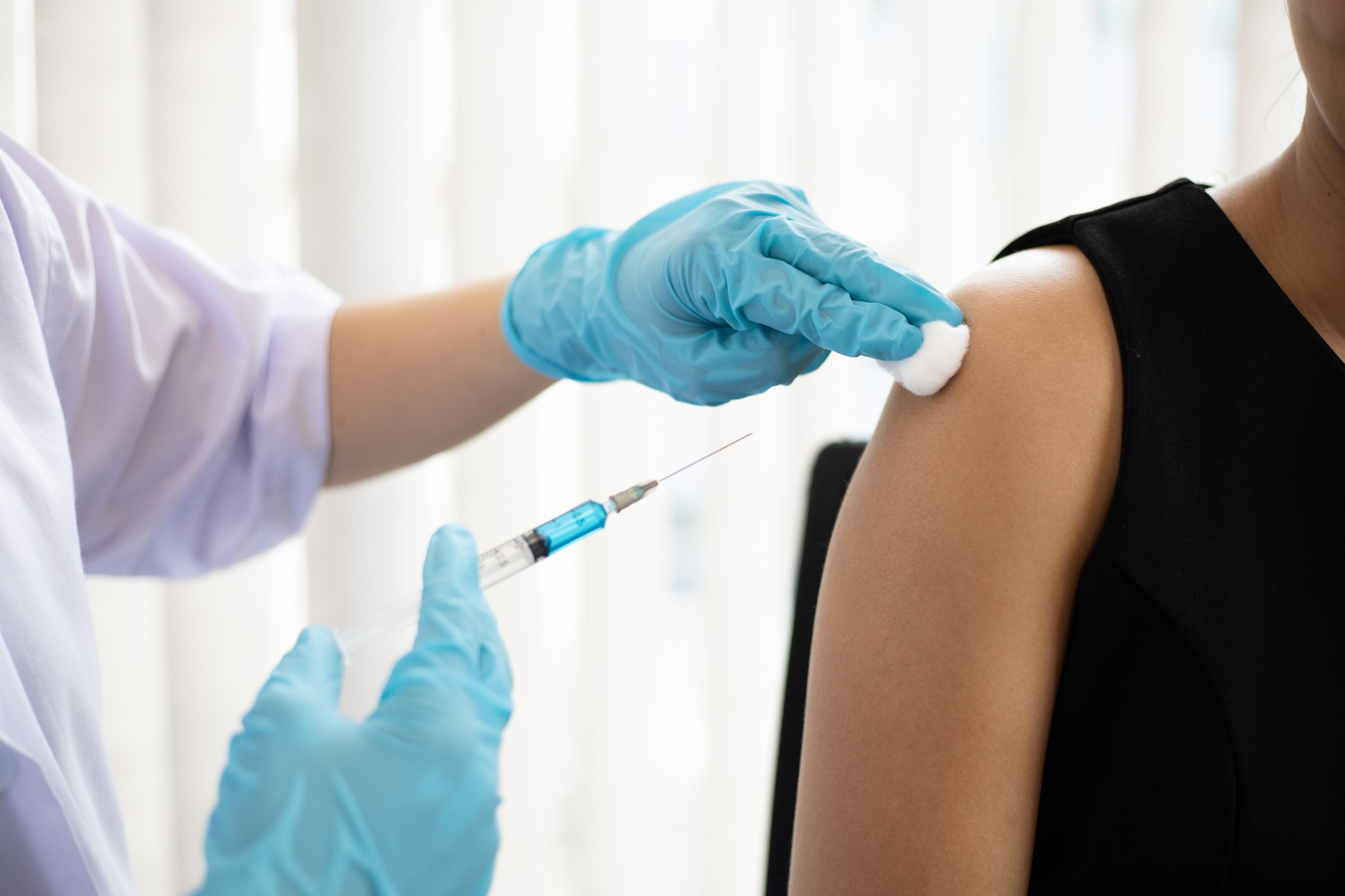 PHOTO: A health professional is seen vaccinating a person.