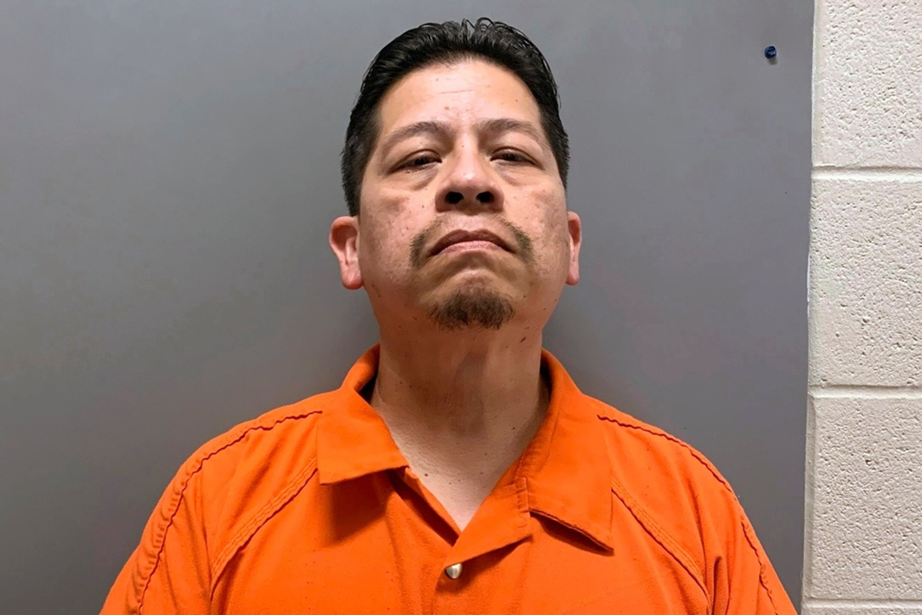 PHOTO: This booking image provided by Uvalde County, Texas, Sheriff's Office shows Adrian Gonzales, a former police officer for schools in Uvalde, Texas, who was arrested and booked into jail before he was released Friday, June 28, 2024.