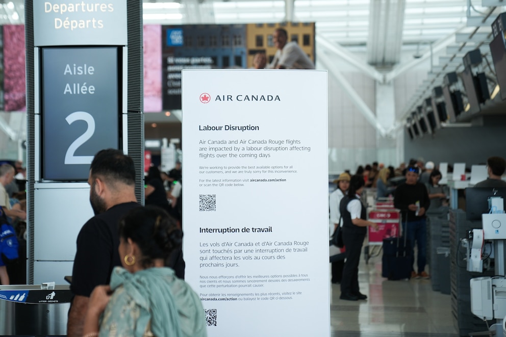 PHOTO: An informative sign that reads 'Labour Disruption' is seen from Toronto Pearson Airport after Air Canada announced it will begin cancelling flights, Aug. 14, 2025, in Toronto, Canada. 