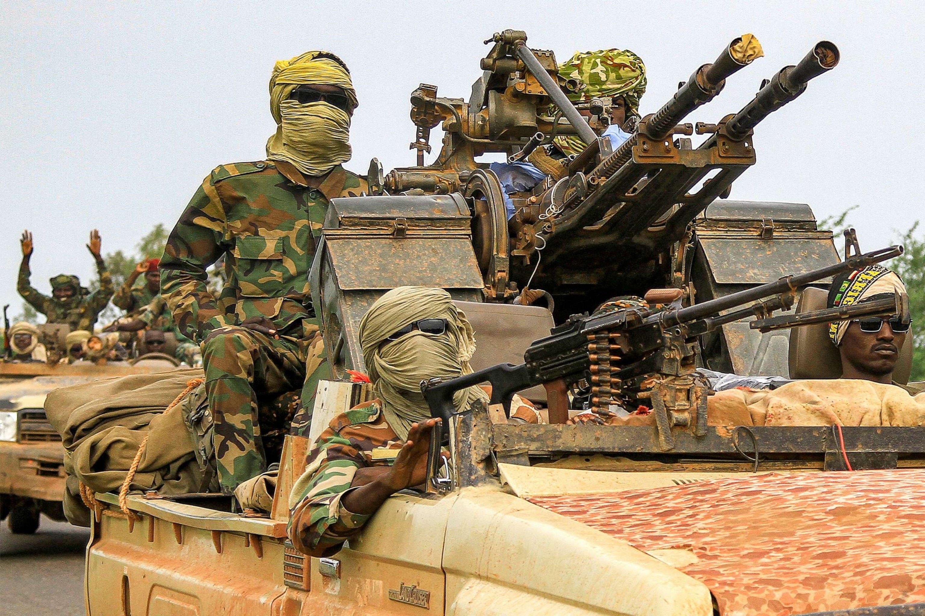 PHOTO: Fighters ride in a vehicle moving in a military convoy accompanying the governor of Sudan's Darfur State during a stopover in the eastern city of Gedaref while on the way to Port Sudan, on Aug. 30, 2023.