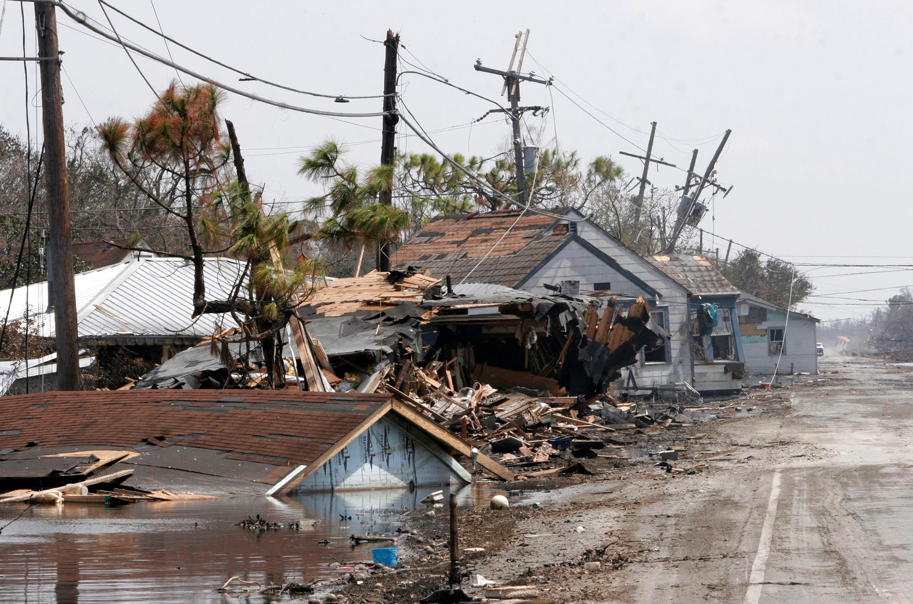 PHOTO: In this Sept. 6, 2005, file photo, homes destroyed by Hurricane Katrina line the main road in Port Sulfur, Louisiana. 
