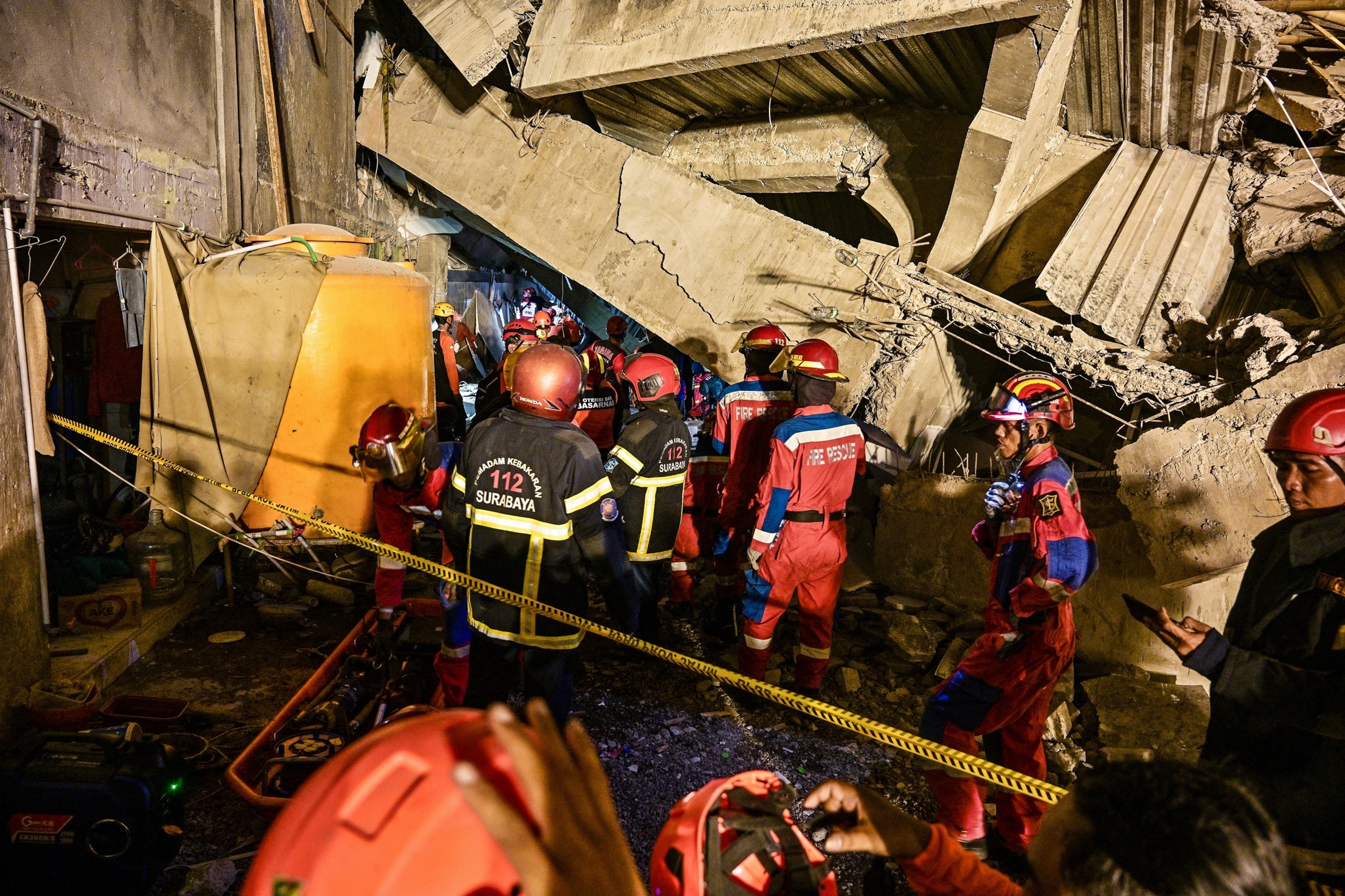PHOTO: Rescue personnel search for survivors after a building collapsed at an Islamic boarding school in Sidoarjo, East Java province on September 29, 2025, injuring a number of students and trapping several others under the rubble.