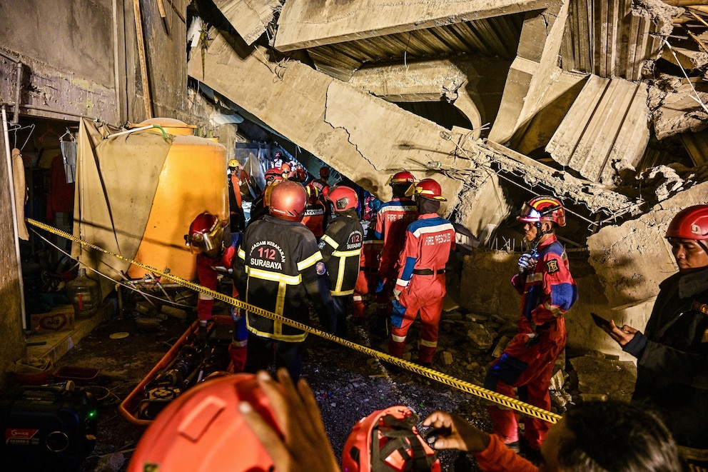 PHOTO: Rescue personnel search for survivors after a building collapsed at an Islamic boarding school in Sidoarjo, East Java province on September 29, 2025, injuring a number of students and trapping several others under the rubble.