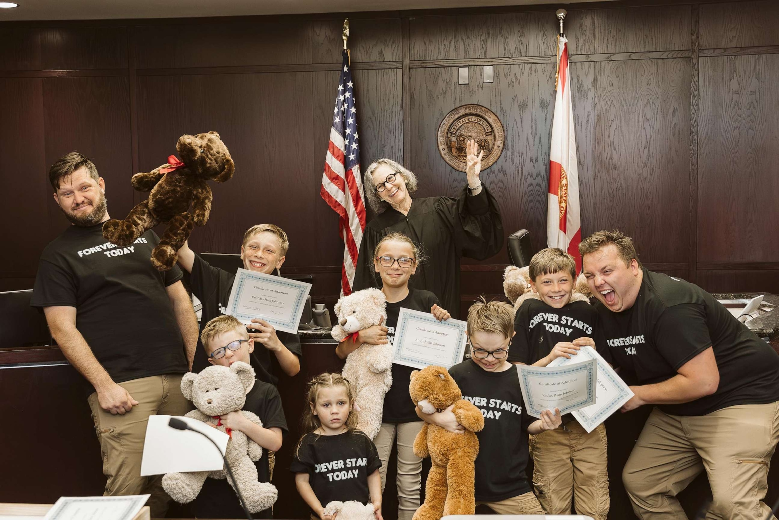 PHOTO: Dustin and Daniel Johnson, of Florida, are celebrating their first Father's Day after formally adoption six siblings in May 2023.