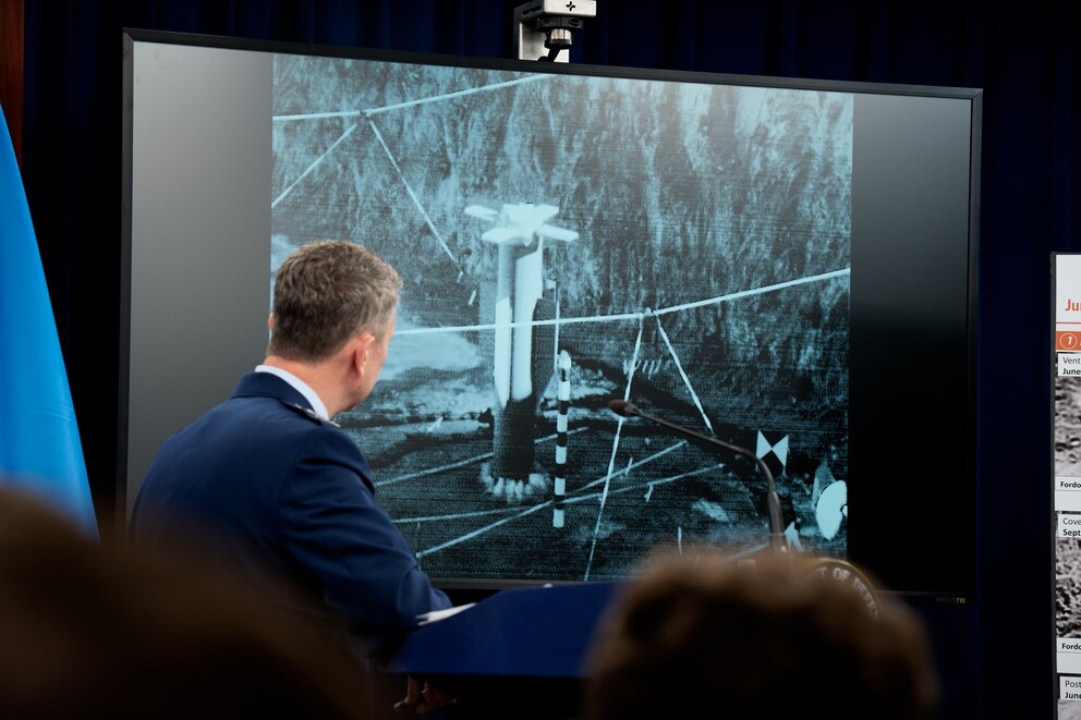 PHOTO: Chairman of the Joint Chiefs of Staff Air Force Gen. Dan Caine turns to watch a video of a bombing test of the GBU-57A/B Massive Ordnance Penetrator during a news conference at the Pentagon, June 26, 2025, in Arlington, Virginia. 