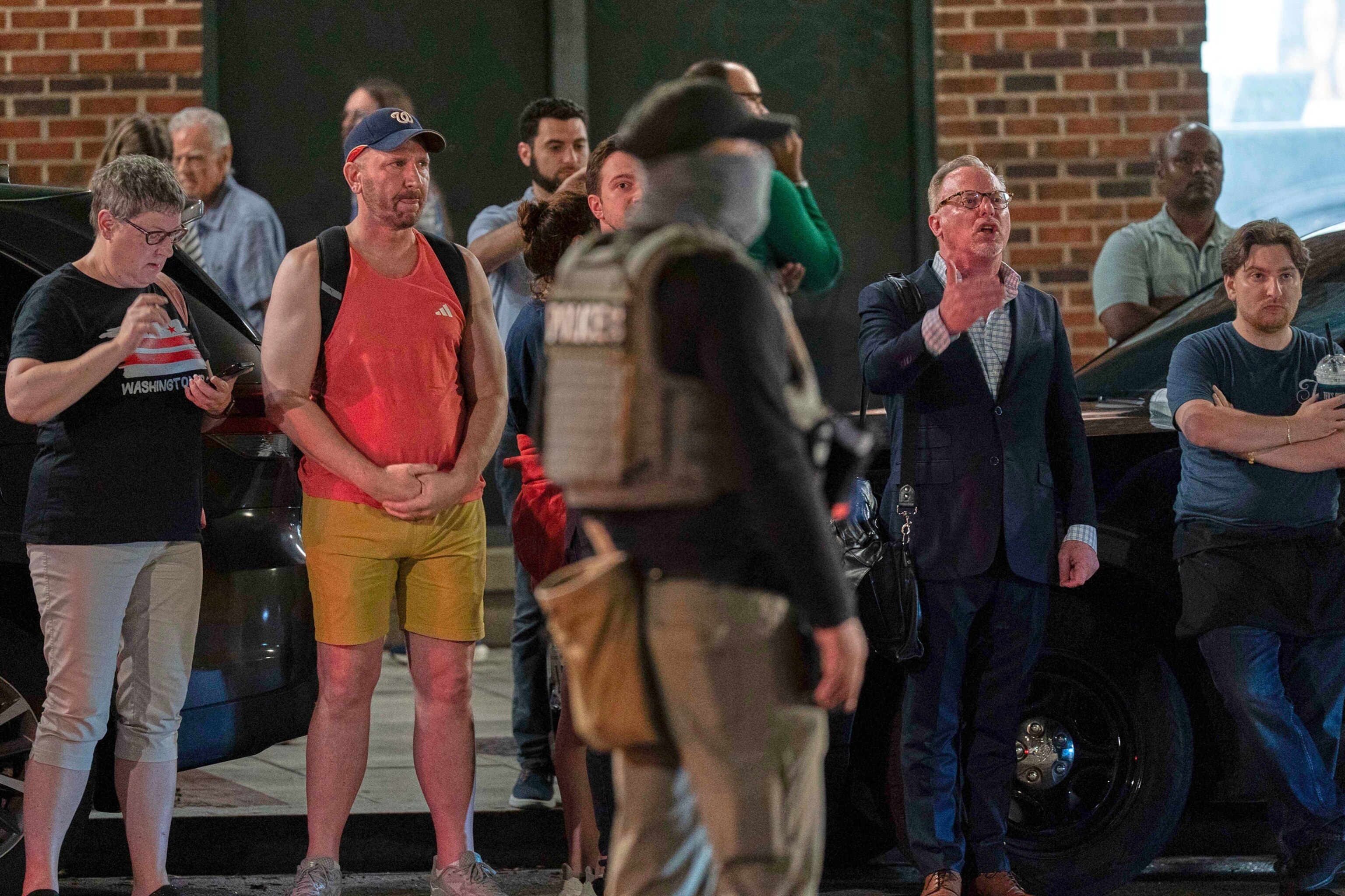 PHOTO: Residents of the area yell at agents of the Department of Homeland Security during traffic checks at a checkpoint along 14th Street in northwest Washington, Aug. 13, 2025, in Washington. 