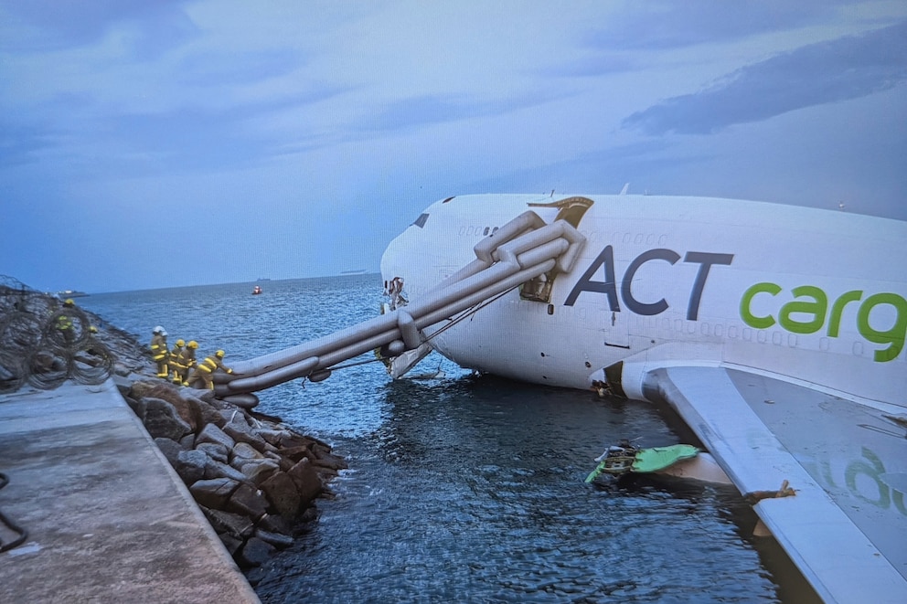PHOTO: This handout photo taken and released on Oct. 20, 2025, by Airport Authority Hong Kong shows a Boeing 747-400 cargo aircraft after it hit a ground vehicle during landing on the north runway of Hong Kong's international airport.