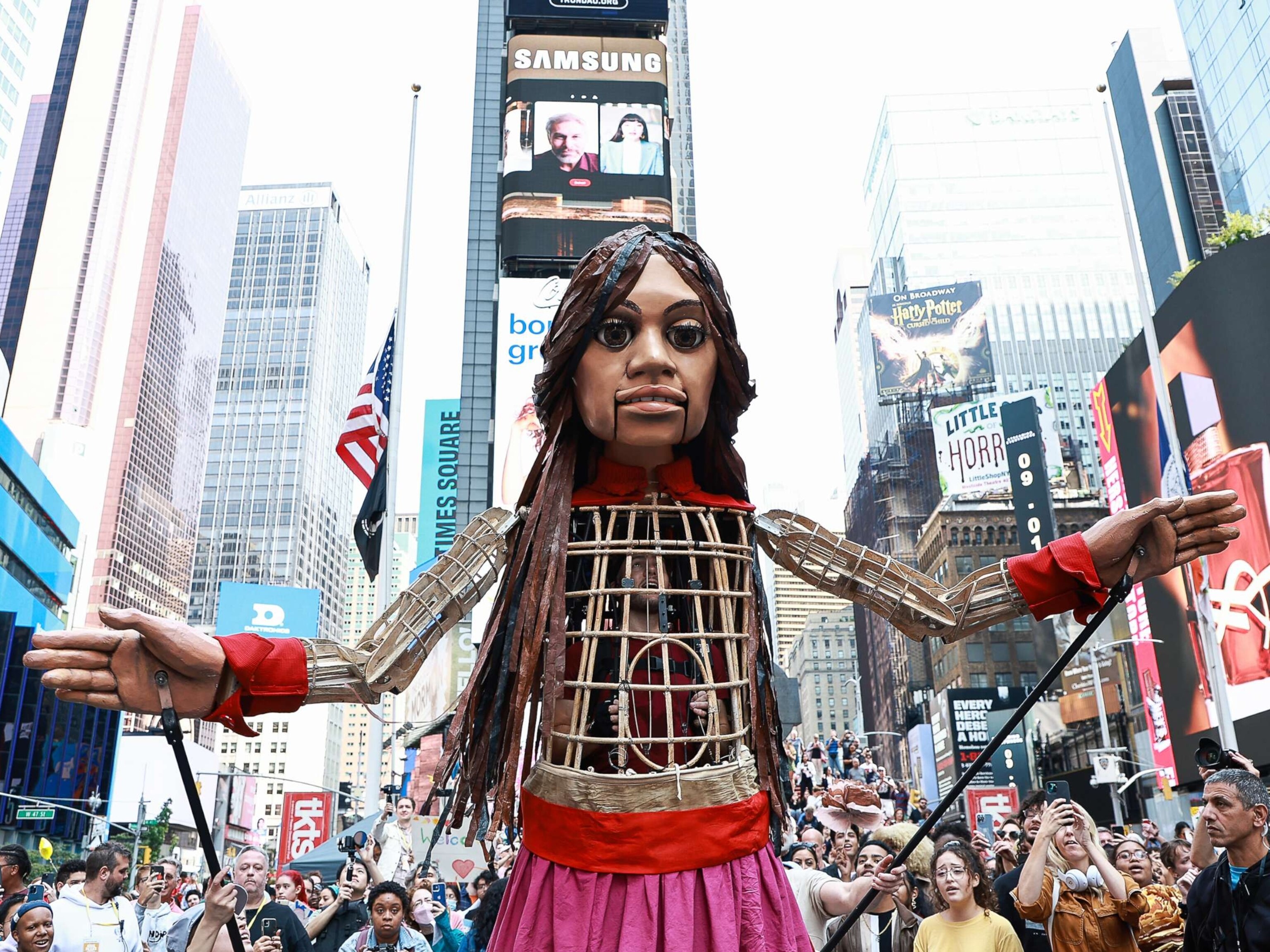 PHOTO: A 12-foot puppet known as "Little Amal" symbolizing a 10-year-old Syrian refugee girl, walks through Times Square, Sept. 16, 2022, in New York City.