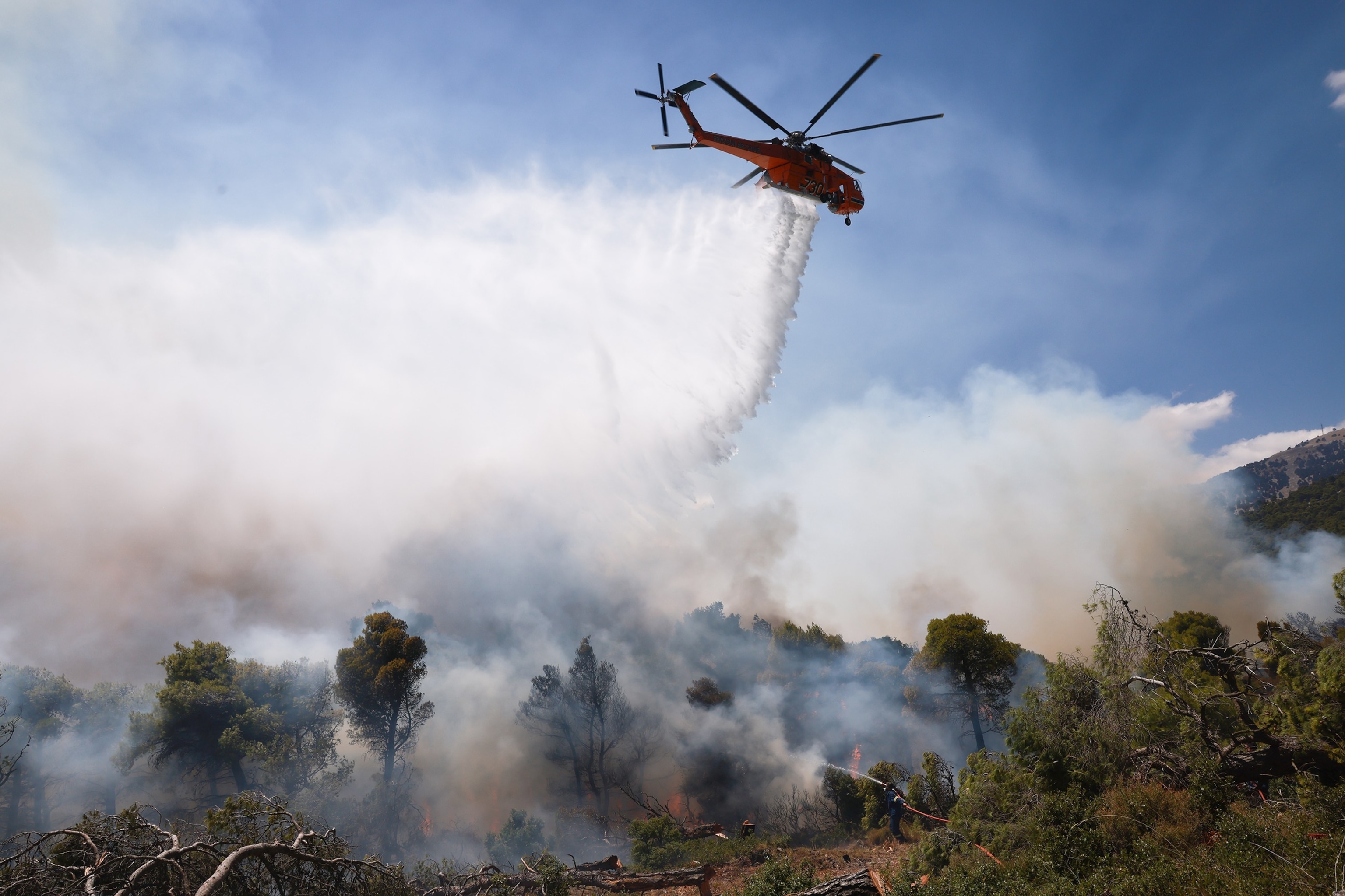 PHOTO: A firefighting helicopter battles a wildfire burning near Porto Germeno, 43 miles northwest of Athens, in the region of Viotia, Greece, August 2, 2026.