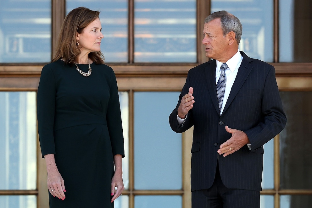 PHOTO: In this Oct. 21, 2021, file photo, U.S. Supreme Court Associate Justice Amy Coney Barrett and Chief Justice John Roberts pause for photographs at the top of the steps of the Supreme Court following her investiture ceremony in Washington, D.C.