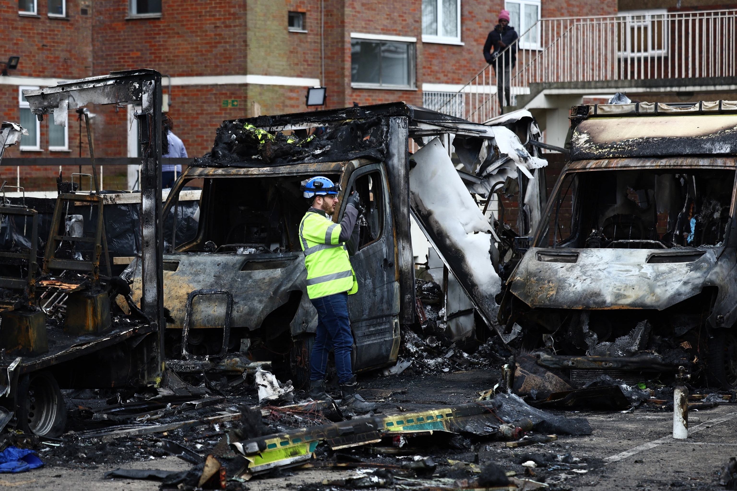 PHOTO: An official works among the burnt out ambulances at the scene of an antisemitic arson attack in the Golders Green neighbourhood of north London, on March 24, 2026.