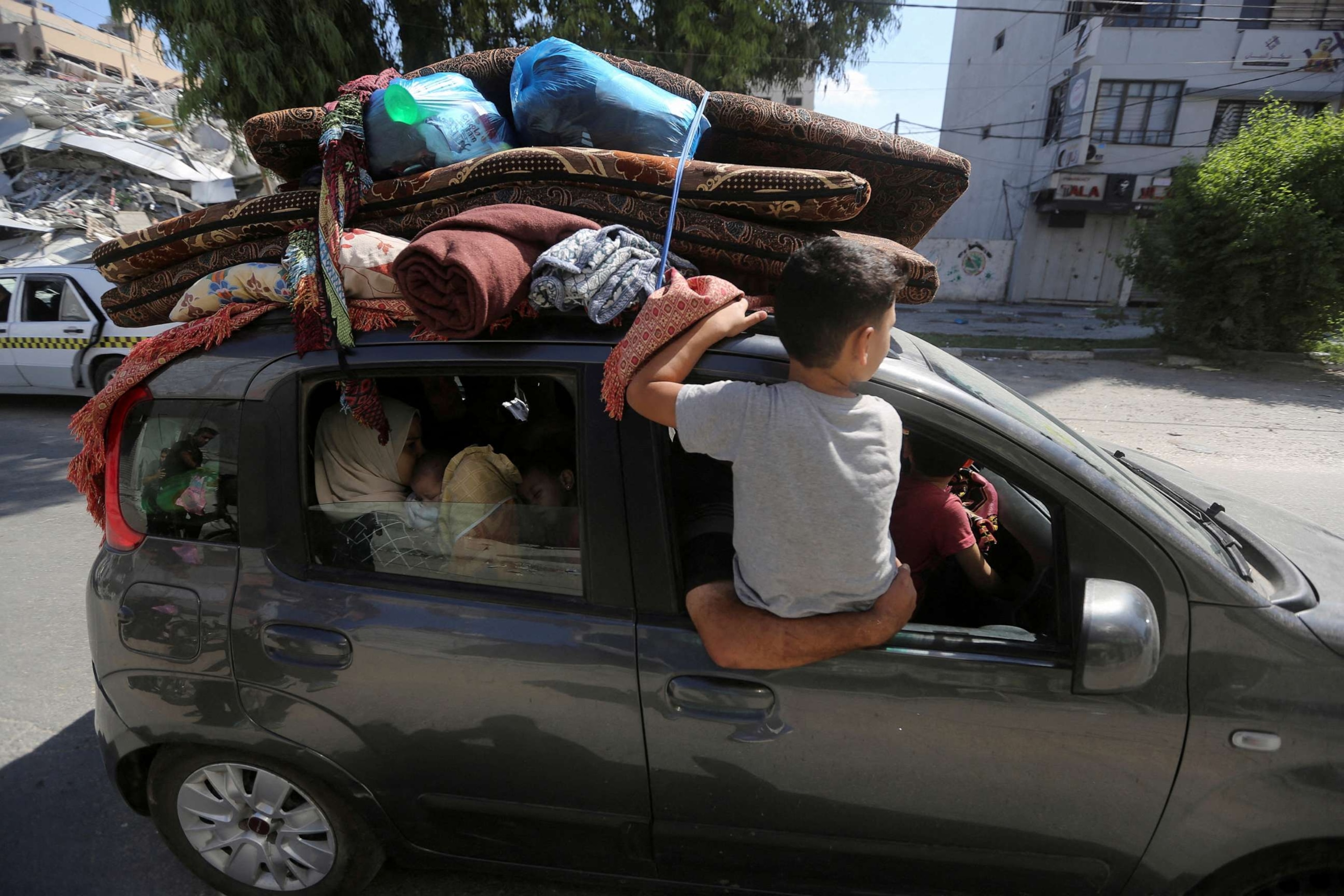 PHOTO: Palestinians flee their houses heading toward the southern part of Gaza Strip after Israel's call for more than 1 million civilians in northern Gaza to move south within 24 hours, amid the Israeli-Palestinian conflict in Gaza City, Oct. 13, 2023.