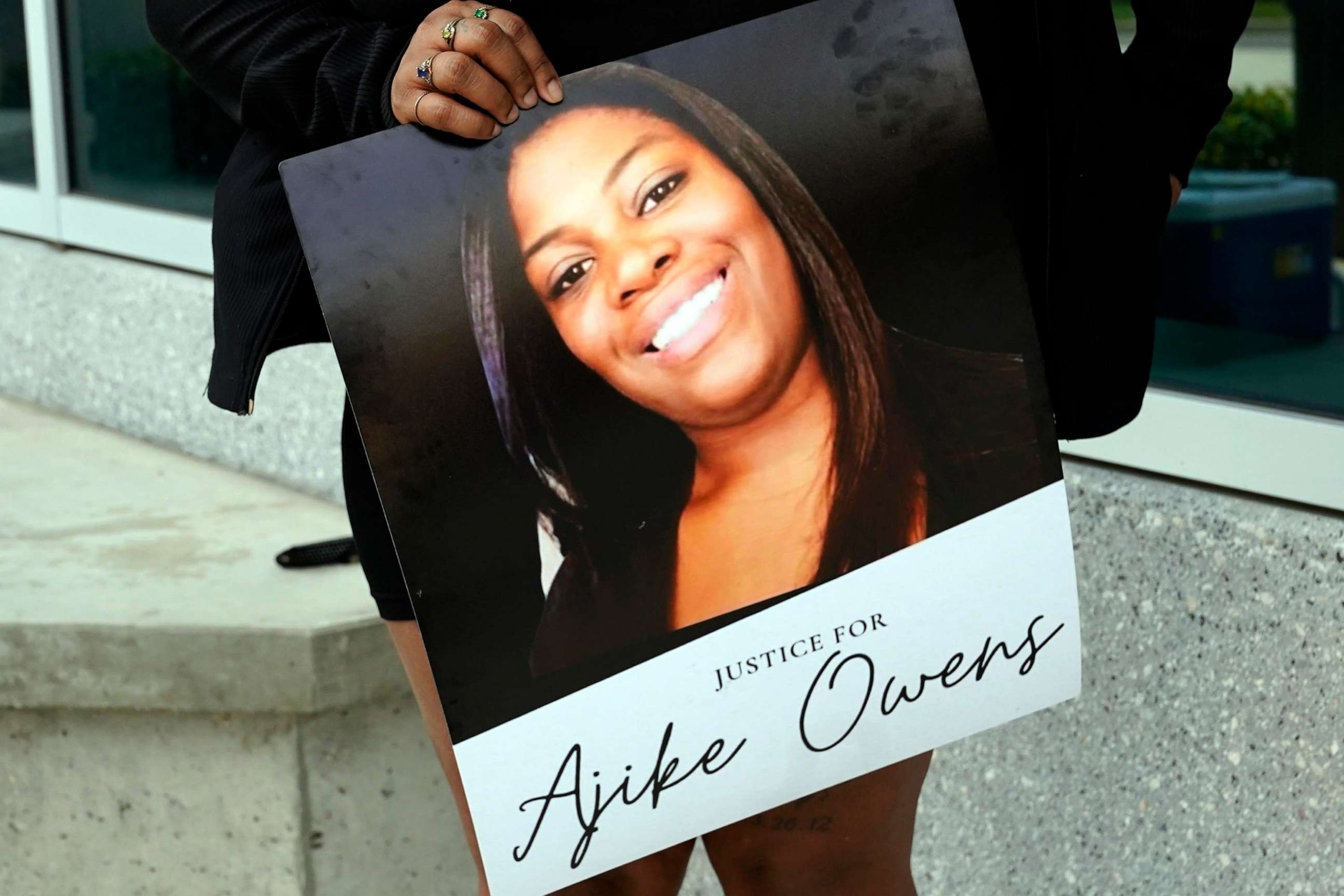 PHOTO: A protester holds a poster of Ajike Owens at the Marion Co,unty Courthouse, on, June 6, 2023, in Ocala, Fla.