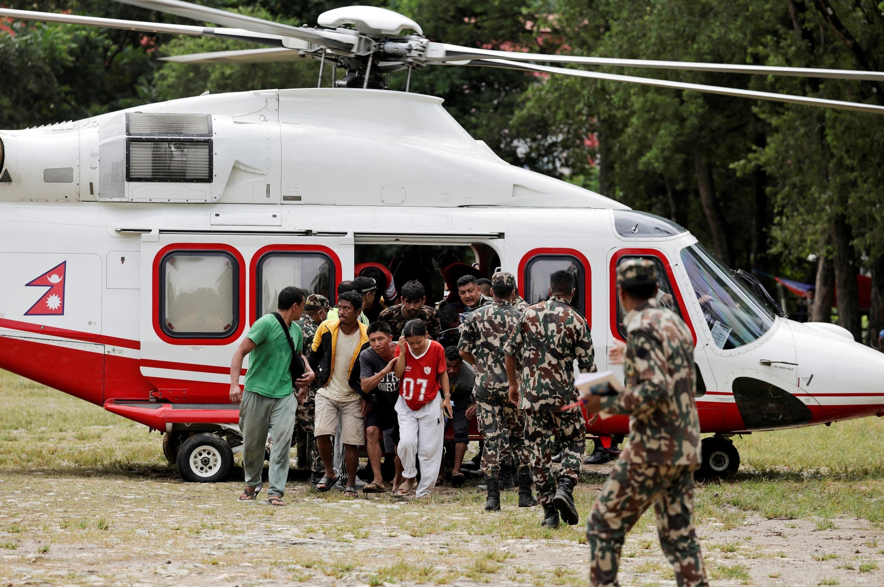 PHOTO: People rescued and airlifted from flood-affected areas arrive at Maithali Barrack, in Trishuli, Nuwakot district, Nepal, Aug. 29, 2026. 