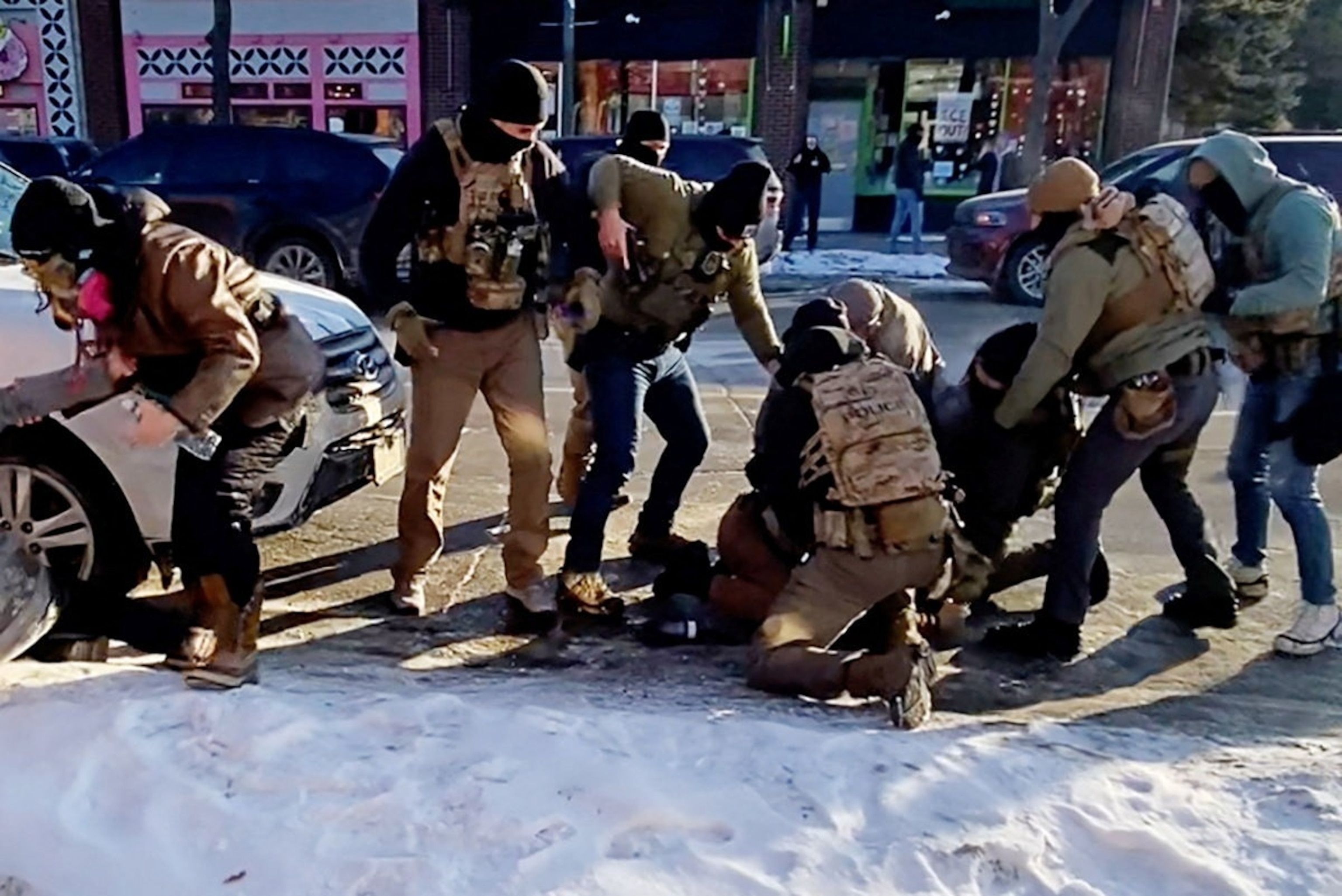 PHOTO: The moment that the firearm of a man identified as Alex Pretti is retrieved from a waistband holster by a federal officer is seen in Minneapolis