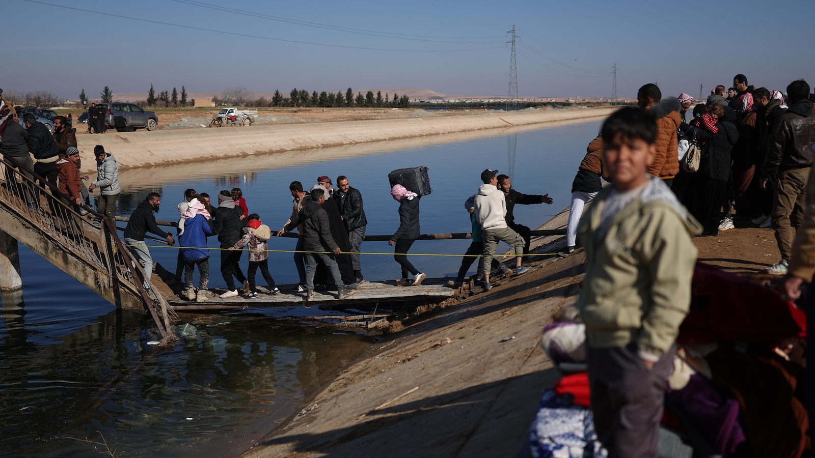 Hundreds flee to government-held areas in north Syria ahead of possible offensive